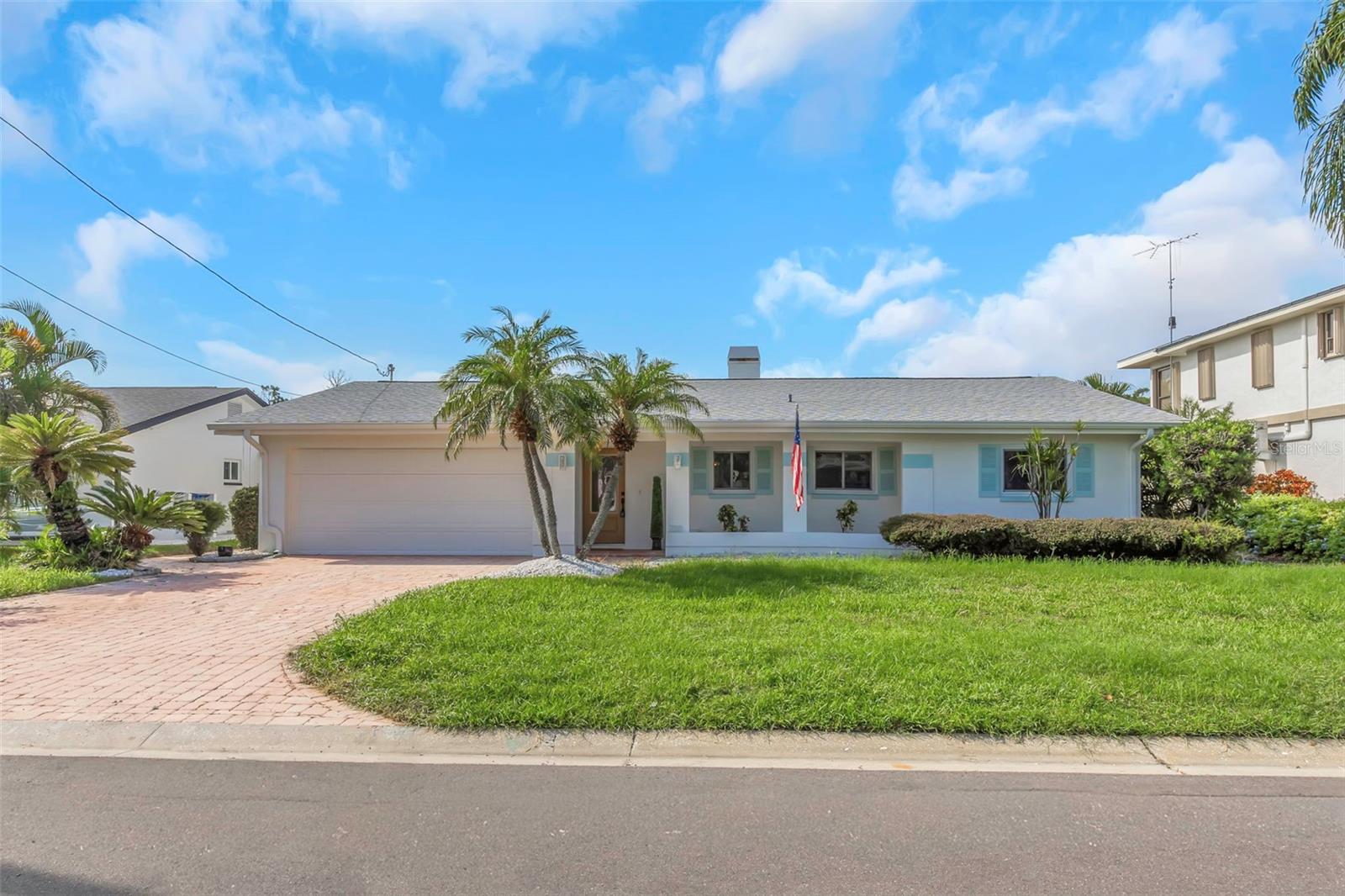 Now available—an exceptional waterfront retreat in the heart of Palm Harbor. Welcome to 220 Driftwood Dr S, a beautifully renovated 4-bedroom, 2-bathroom residence offering refined coastal living with direct Gulf access.Designed with both elegance and functionality in mind, the home features an open-concept floor plan highlighted by luxury vinyl plank flooring and thoughtfully updated interior finishes. The chef-inspired kitchen showcases a spacious center island with a built-in cooktop, creating an ideal setting for entertaining and everyday living. A fireplace adds a sophisticated focal point to the main living area, enhancing the home’s warm and inviting ambiance.Outdoors, experience true Florida luxury. The screened-in pool and spa overlook a tranquil canal with direct access to the Gulf, providing a private oasis for relaxation or entertaining. A private dock and boat lift offer seamless access to the water, perfect for boating enthusiasts and sunset cruises.The primary suite serves as a serene retreat, complete with a newly renovated en-suite bathroom. Additional features include a 2-car garage and a layout designed to maximize comfort, privacy, and waterfront views.This is a rare opportunity to own a move-in-ready waterfront home in one of Palm Harbor’s most desirable communities. All information deemed reliable but not guaranteed. Buyer to verify HOA information, property measurements, and waterfront details.