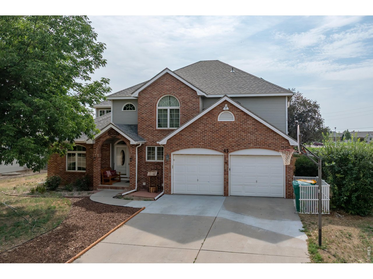 Grand 2-story brick home built in 1994 with 5 bedrooms, and 4 bathrooms. You will love the bright light and views of the manicured yard from the ample windows. Comfortable living room with high ceiling, fireplace and built-in display cabinets and storage, formal dining area and kitchen with beautiful wood floors, raised breakfast bar, and breakfast nook. Kitchen features a large side by side refrigerator/freezer, flat top electric stove, microwave and built-in double oven. Master bathroom has a tray ceiling, master bath with double sink vanity, a soaker tub and walk-in closet. Large utility room with extra storage, utility sink and clothes folding area. Step downstairs to a huge family room with more built-ins, plus a 5th bedroom, and 3/4 bath with double sink vanity. CENTRAL A/C. Home backs up to Centennial Park with an easy drive to Benjamin Eaton Elementary School and Eaton High School.