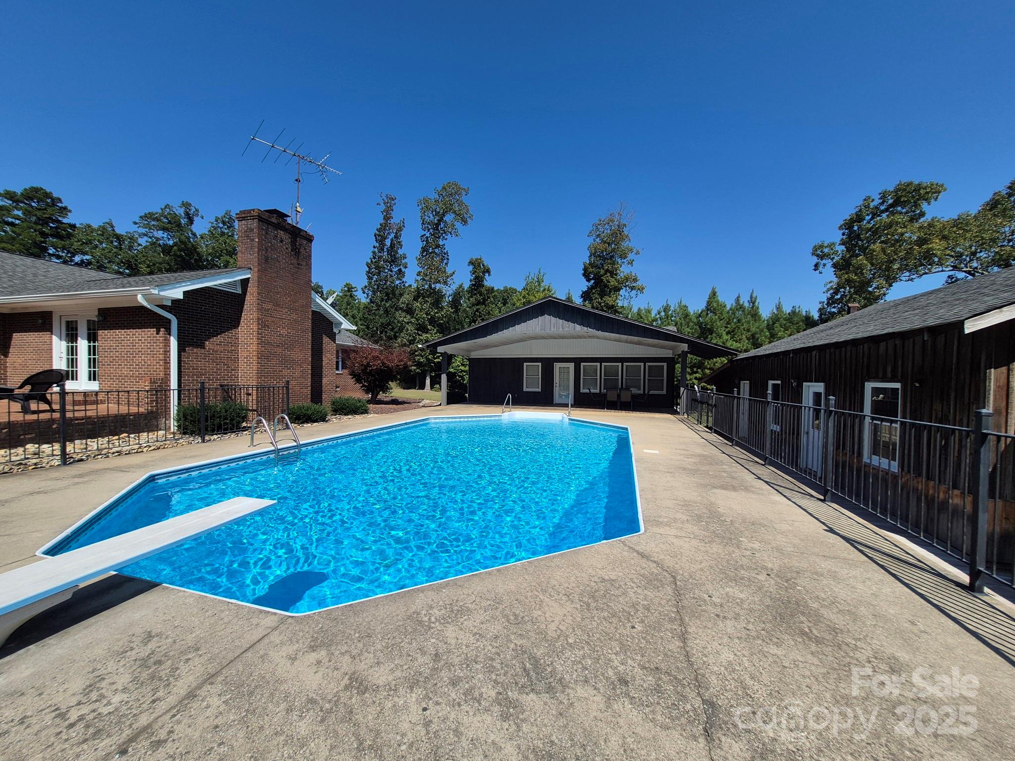 Biscoe - THIS ONE HAS IT ALL!  Custom Built 3-Bedroom, 2.5-bath Brick Ranch.  Features spacious den with stone fireplace, family room, gourmet kitchen with two pantries, dining room, study, office, laundry room on beautifully landscaped 11.7 acres.  Enjoy the beautiful inground pool; ideal for relaxing and entertaining.  This property also includes a separate 930 sq. ft, guest house; 729 sq. ft. heated and cooled out building, also additional outbuilding great for storage, a workshop or a studio.  Located a short drive from the By-Pass makes it easily accessible to Asheboro, Greensboro, Southern Pines, Rockingham.  Call for your appointment today!  The property has two septic tanks.  A 3 bedroom septic system for the home and a separate 1 bedroom septic system for the guest house.  The septic tank for the primary home was pumped two years ago.