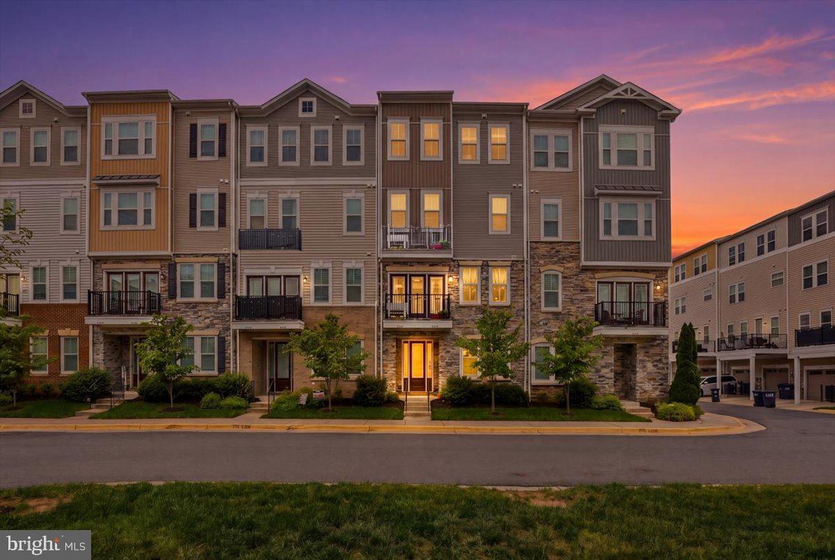 Welcome to 42045 Berkley Hill Terrace in the sought-after Stone Mill Corner community of Stone Ridge! This beautifully designed 4-level condo townhome offers over 2,200 square feet of stylish and functional living space with 3 spacious bedrooms, 2.5 bathrooms, and a 1-car rear-entry garage.Built in 2017 by Van Metre Homes, this contemporary “Woodson” model features an open-concept floor plan ideal for both everyday living and entertaining. The main level showcases hardwood flooring throughout the home, an expansive living and dining area, and a gourmet kitchen complete with granite countertops, a large center island with pendant lighting, upgraded stainless steel appliances, gas cooking, double ovens, and abundant cabinet space. Step outside to a private composite deck — perfect for morning coffee or evening relaxation.The luxurious primary suite occupies its own private level and includes a custom-built walk-in closet with a California closet system and spa-inspired en-suite bath with dual vanities, soaking tub, and separate shower. The upper level features two additional generously sized bedrooms, a full bath, and convenient bedroom-level laundry. The entry level offers flexible space ideal for a home office, gym, mudroom, or recreation area.Additional upgrades and features include custom 2" wood blinds with fabric tape, upgraded level-5 carpeting and padding on stairs, recessed lighting, Hunter and Kichler ceiling fans with remote controls, upgraded bathrooms with floor-to-ceiling tiles and luxury-height toilets, upgraded powder room appointments, an insulated garage door, and ample storage throughout.Residents of Stone Mill Corner enjoy access to Stone Ridge’s outstanding community amenities, including multiple pools (one saltwater pool), clubhouse, fitness center, tennis and basketball courts, walking trails, parks, amphitheater, and playgrounds. Conveniently located near shopping, dining, commuter routes, Dulles Airport, and top-rated Loudoun County schools.This is better than any New Construction at a better priceModern comfort, thoughtful upgrades, and an unbeatable location — this is the one you’ve been waiting for!