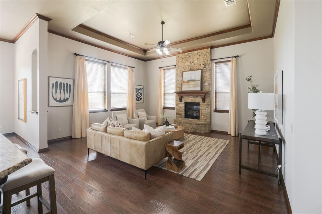 Tucked away on a quiet street with two cul-de-sacs in one of Deer Creek’s most desirable neighborhoods, this 4-bedroom, 3-bathroom home offers space, function, and thoughtful design at every turn—with a dedicated office and theater room, there's room for everyone and everything. As you step inside, you'll find a private study with custom built-ins just off the entry—perfect for working from home or simply enjoying a quiet space to focus. Just beyond the study, a hallway leads to three secondary bedrooms and two full bathrooms, giving everyone their own space and creating a smart separation from the primary suite and main living areas. Continue into the home you are greeted by soaring ceilings and a beautifully open floor plan that blends comfort with everyday ease. The kitchen features dual islands with bar seating and a walk-in pantry. Just opposite the kitchen is the living room with an elegant, floor-to-ceiling stone fireplace. The large primary bedroom easily accommodates king-sized furnishings + sitting space. The ensuite bath includes dual sinks, a walk-in shower, garden tub, and walk-in closet. You will love the utility room with a built-in mud bench and the home’s theater room—a perfect spot for movie nights, gaming, or your favorite streaming marathons. Step outside to the covered back patio that overlooks peaceful farmland — with an East Facing Backyard and Patio, it’s the perfect setting for morning coffee watching the sunrise, backyard barbecues, or unwinding in the evening. Zoned to top-rated Deer Creek Schools walkable to the brand-new Knight Ridge Elementary, this home offers the ideal blend of modern living, quiet surroundings, and unbeatable convenience. Just one mile from the Kilpatrick Turnpike and minutes to Hefner Parkway. Tons of shopping, dining, and entertainment close by. If you’ve been looking for more space, more comfort, and a layout that just makes sense—you’ve found it. Brand New Roof, New Carpet + Fresh Paint Throughout.
