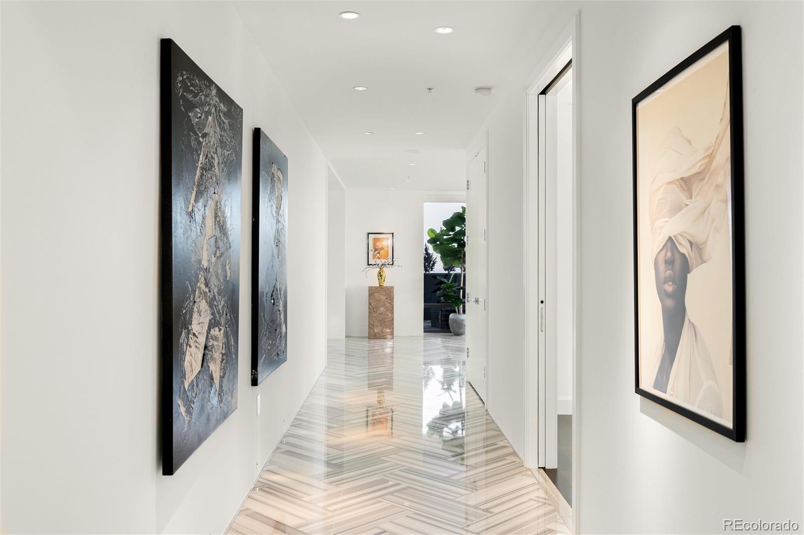 Are you seeking something completely unique and unlike anything else available at the Four Seasons Private Residences?  Something sleek, modern, sophisticated? Welcome to Residence #4050 - a true masterpiece of vision and design, and undeniably the best value to be found. Originally conceived as the private residence of one of the world’s most revered masters of public architecture, it bears the unmistakable imprint of precision, discipline, and artistry. Every proportion, every line, every transition was intentional. Spanning half the 40th floor and offering over 4,800 sq ft,  this 3-bedroom, 4-bath residence evokes a refined international sensibility and provides a minimalist, nearly blank canvas upon which new stories may be written without diminishing its purity. Walls of glass invite light to move across marble floors and polished surfaces, transforming the home throughout the day, while at night the city below becomes a glittering sea of lights. Two expansive covered balconies, framed by bespoke custom planters, extend the living spaces outward, framing both mountain vistas and urban horizons while preserving perfect privacy. The primary suite continues the architectural dialogue with a custom-designed bed frame and a wall of meticulously crafted closets. The spa-inspired bath is serene and luxurious with its deep soaking tub and dual vanities. Two additional guest suites reflect the same commitment to comfort and refinement. Custom lighting, remote-controlled shades, and other thoughtful integrations heighten both simplicity and ease. Life at the Four Seasons Private Residences is a continuation of this artful living, supported by experienced staff who master the craft of service. Residents enjoy 24-hour concierge and valet, in-residence dining, housekeeping, a full-service spa, state-of-the-art fitness center, and a year-round saltwater pool. Here in Residence #4050, architecture and lifestyle meet in perfect harmony at Denver’s most prestigious address.