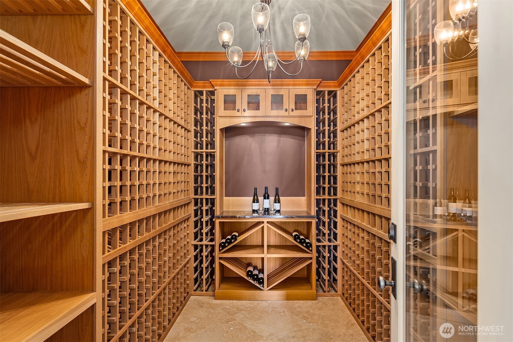 An impressive 900+ bottle wine cellar stands ready for collectors, offering the perfect environment for aging, showcasing and savoring every bottle.