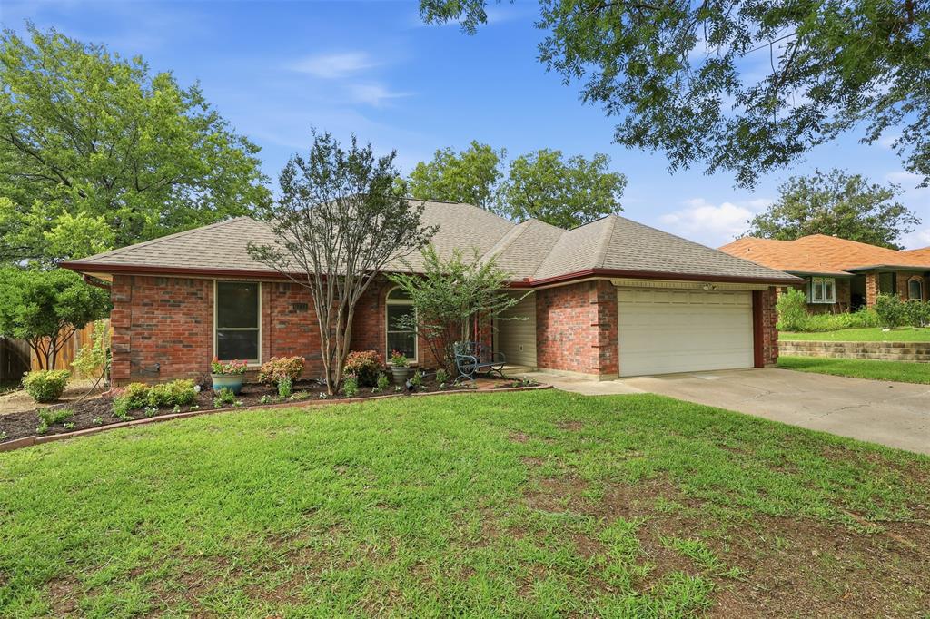 Welcome home to this charming, move-in ready single-story gem in the heart of North Richland Hills! Featuring 3 bedrooms and 2 full bathrooms, along with a lovely dining area filled with natural light throughout the home. Thoughtfully updated with fresh white paint throughout, this home offers a bright, airy feel and timeless appeal. In 2024, all flooring in the home was updated to oak LVP, all bedroom carpets were replaced, and all bathroom tile was fully replaced. The inviting living room showcases beautiful custom wood paneling, creating a warm focal point that’s perfect for relaxing or entertaining.Soaring ceilings and an abundance of natural light enhance the spacious yet cozy atmosphere throughout the home. Major system updates provide added peace of mind, including a roof replacement in 2019 and an HVAC system replaced in 2022 with warranty coverage through 2032. Step outside to enjoy the beautifully maintained backyard, complete with a lovely garden, a sprinkler system, and a covered patio-ideal for morning coffee, weekend gatherings, or simply unwinding outdoors.Lovingly maintained and truly move-in ready, this home includes all kitchen appliances, plus the refrigerator, washer, and dryer, offering exceptional value and convenience for its next owners. Located in a well-maintained neighborhood with no HOA, this property offers added freedom and flexibility. Conveniently situated close to major shopping areas and highways, it provides excellent accessibility for commuting, dining, and everyday needs.Combining comfort, style, and functionality, this North Richland Hills beauty is ready to welcome you home. Don’t miss your opportunity to make it yours!