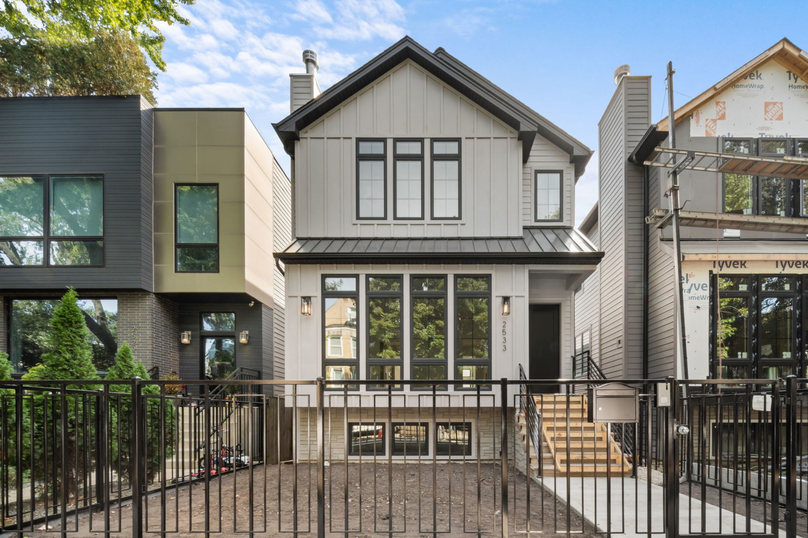 Presenting 2535 W Belden: An extra wide new construction single family home in premier Logan Square pocket. Sitting on a 29' wide lot, the property features 5 bedrooms, 3.1 bathrooms, expansive garage with oversized garage roof deck & bespoke design and finishes throughout.     Light filled main level features front facing over sized black on black windows, two fireplaces, oak hardwood flooring, detailed coffered ceiling & wall trim, professional grade kitchen with custom cabinetry, paneled Sub Zero and Thermador appliances, 48" hood vent with matching 48" range top, slab waterfall quartz countertops & over sized island. Open rear entry mud room with south facing exposure, custom built bench, design tile & beautiful wall trim.     Top floor features show stopping primary suite with dual walk-in closets, designer primary bathroom with heated floors, floor to ceiling tile, expansive & opulent double vanity, soaking tub & St Regis Spa caliber fixtures. Two oversized additional bedrooms, elegant full second bathroom, laundry room & mechanical room.     Lower level features radiant heated flooring, excellent ceiling height, large family room, fully built out wet bar, two additional large bedrooms, third full   bathroom, second full laundry room, second mechanical room & tons of storage. Property is located in Goethe elementary school district and is a short walk to the blue line and every imaginable restaurant, shop & yoga studio in both Logan and Bucktown. Very experienced & reputable local developer with late 2025 delivery. Photos shown from a previously built house by the same developer. Show with confidence!