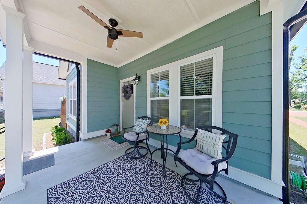 Welcome home to this charming cottage-style retreat in the sought after Victoria Park community, just a short stroll from the heart of the bricks of downtown Thomasville! Built only four years ago, this beautifully maintained home offers the perfect blend of modern convenience and timeless Southern charm. Relax on the inviting rocking chair front porch overlooking the greenspace of Victoria Park or unwind in the side screened porch while enjoying peaceful evenings at home.  Inside, the thoughtfully designed open-concept floor plan creates a bright and welcoming atmosphere, seamlessly connecting the kitchen, dining, and living areas -- ideal for both entertaining and everyday living. This spacious three-bedroom, two-bath home features quality craftsmanship throughout, along with practical upgrades that make daily life easy and comfortable. The custom-built 8'X10'X10' wired outbuilding perfectly matches the home's exterior and provides excellent additional storage or workshop space.  A privacy-fenced area on either side of the screened porch offer flexibility for pets, gardening, or outdoor enjoyment. Additional highlights of the property include a four-car concrete parking pad, gutters, extra floored attic storage, window blinds throughout, and an exterior-vented kitchen exhaust fan.  Enjoy the convenience of being within walking distance to downtown dining, shopping, and entertainment while still enjoying the comfort of a quiet neighborhood setting. This move-in ready cottage offers the best of Thomasville living with style, comfort, and location all in one package. Call to make your appointment to visit this one-of-a-kind property today or have a look thru the Virtual I-Guide Tour here: https://unbranded.youriguide.com/207_armster_ln_thomasville_ga/