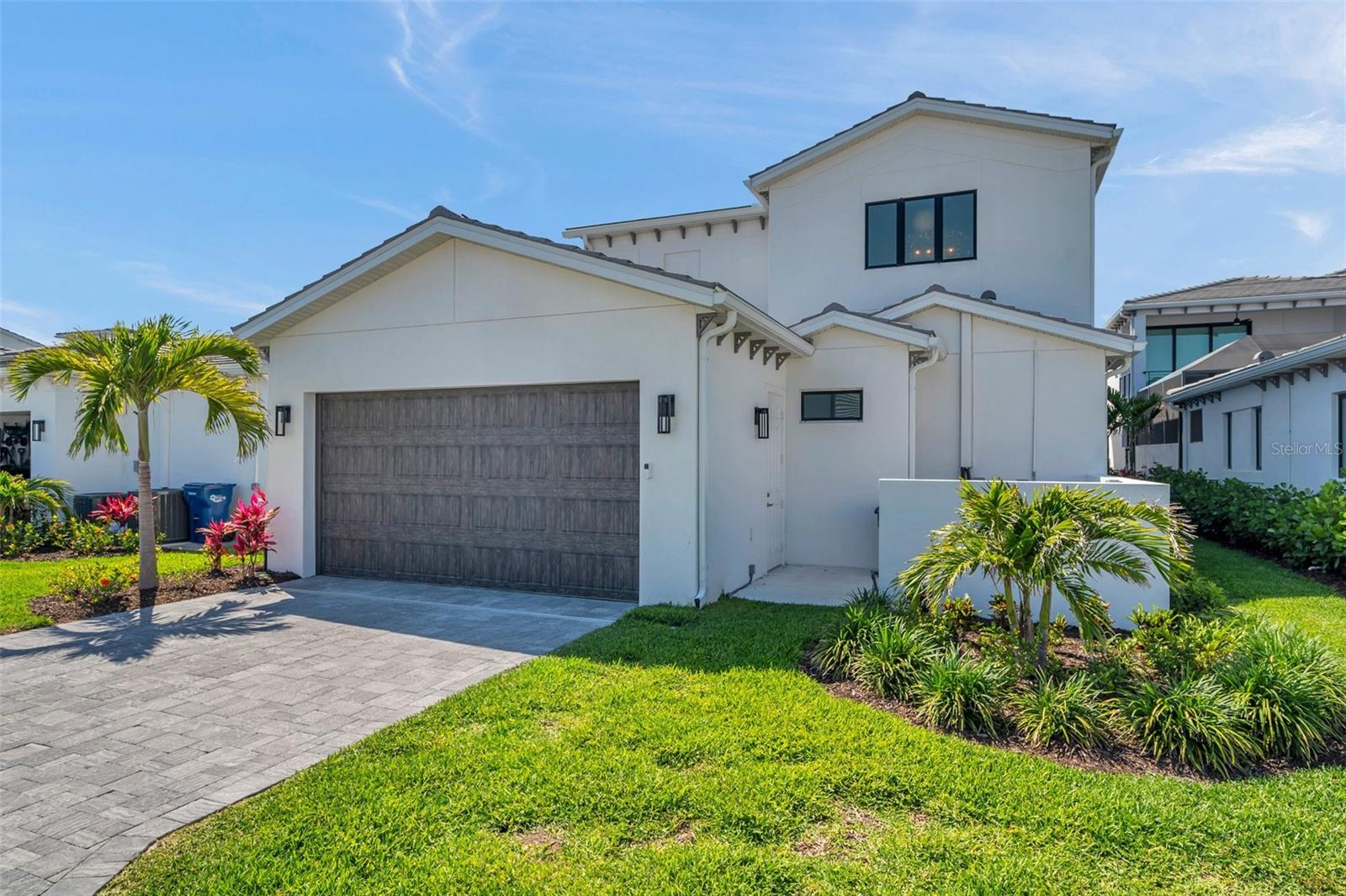 Welcome to one of the most expansive and upgraded homes in the private, gated community of Aqua- thoughtfully designed with IMG Academy families in mind. Spanning nearly 4,300 square feet, this custom-built Salt Meadow model offers 5 bedrooms, 6 bathrooms, and an unmatched blend of luxury, comfort, and efficiency.
Every detail of this residence has been carefully curated. Soaring 10-foot ceilings on both levels, tray ceiling accents, and oversized windows create a bright and airy atmosphere. Each bedroom features its own ensuite bathroom and walk-in closet, providing privacy and convenience for family and guests alike.
The gourmet kitchen is the heart of the home, extended by six feet to accommodate a stunning 7-by-12-foot island- ideal for entertaining, cooking, and gatherings. Custom cabinetry with Flemish glass, quartz countertops, premium appliances (including a built-in air fryer, wine refrigerator, and canopy range hood), and upgraded hardware elevate both function and style.
The main suite comes with a custom oversized walk-in closet, complete with quartz-topped center island, premium shelving, and an abundance of natural light coming through the large window- all creating a boutique dressing experience. The primary bathroom features an upgraded freestanding soaking tub and elegant finishes. A second primary suite is located just across the hall- ideal for multigenerational living or guests seeking additional privacy and comfort. Its ensuite bathroom includes both a freestanding tub and a walk-in shower.
The home also features a dedicated office on the second floor, two ensuite bedrooms on the main level for flexible living arrangements, and custom lighting and window treatments.
High-end finishes continue in the bathrooms, where frameless glass shower enclosures, full-height tile, and modern fixtures create a cohesive, upscale feel. Luxury flooring spans the entire home- completely carpet-free.
Practical upgrades include spray foam insulation, whole-house surge protection, and an extended garage- lengthened by an additional six feet- with epoxy-coated flooring.
A private service area provides concealed access to HVAC systems, trash, and pool equipment.
 Outdoors, enjoy a screened lanai with motorized shades and a saltwater heated pool - perfect for relaxing or entertaining year-round.
Located just minutes from IMG Academy and the best beaches in Florida, this one-of-a-kind home offers exceptional craftsmanship, space, and convenience in one of the area’s most sought-after locations. Don’t miss the opportunity- schedule your private showing today.