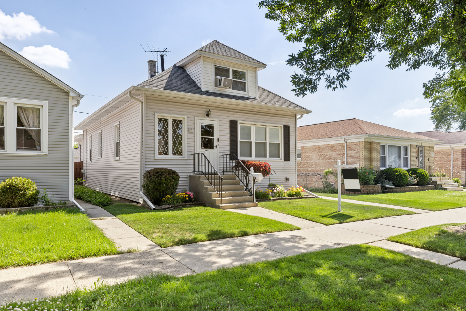 WELCOME HOME to your new 4-bedroom, 2-bathroom home nestled on a rare oversized 40x125 lot in desirable Jefferson Park. Bursting with charm and natural light, this home offers a warm and spacious layout perfect for everyday living and entertaining. Step into a welcoming living space and formal dining room accented by beautiful hardwood floors. The eat-in kitchen is a cook's dream, featuring white cabinets, a stylish tile backsplash, granite countertops, a new undermount sink, dishwasher, and a convenient breakfast bar for casual dining. A versatile enclosed back porch addition extends your living space and is ideal for a playroom, home office, or cozy relaxation area. The second floor boasts two generously sized bedrooms and a full bathroom, while the full unfinished basement provides ample storage or the opportunity to create your dream space. Enjoy outdoor living on the low-maintenance composite deck and take advantage of the nearby green space - just down the block from Indian Road Park, forest preserves, and scenic bike/walking trails. Located near buses, trains, and expressways, this home offers both comfort and accessibility in one of the city's most charming neighborhoods. Updates: Roof (2016), Boiler (2022), Concrete (2016), Siding (2013). HURRY!