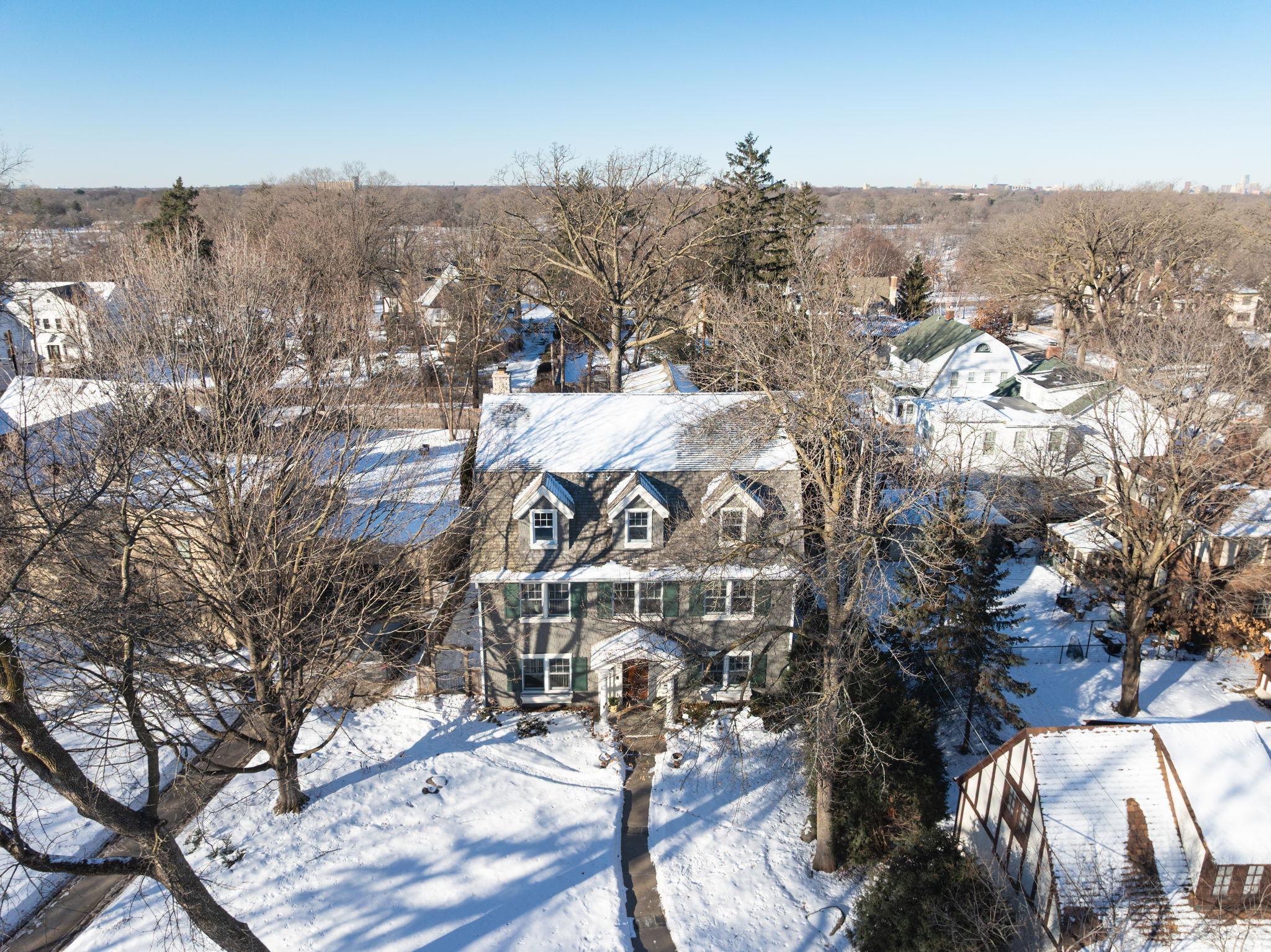 Set on one of the finest streets in St. Paul just off the river and offered publicly for the first time since it was built, this superbly designed, incredibly welcoming home is truly one of the City’s most special properties.  The heart of the main level is its light-filled great room/kitchen complex, featuring a wood burning fplc flanked by great built-in media cabinetry & copper lined wood storage, an elevated library area, and the handsome well-appointed center island kitchen with adjoining banquette dining area with direct views and access to the rear screened porch.  The main level includes an expansive pantry, formal dining room, ½ bath, mudroom & laundry. The cheerful 2nd floor includes 4 spacious bedrooms & two baths, including the vaulted primary bedroom with window seat & 2 walls of built-ins, ¾ bath, and walk-in closet. The delightful 3rd floor, a wonderful retreat, includes vinyl floored craft room with sink, large guest/bonus room, large office & ½ bath.  Meanwhile, the lower level includes a carpeted family/play room.  Built by Norson, additional amenities include closets on all floors designed to accommodate a future elevator, 636sf of office, studio or fitness space above the detached three car garage (baseboard heat plus built-ins), rough-in for lower level bath, drain tile & sump pump, generator, whole house air exchange.