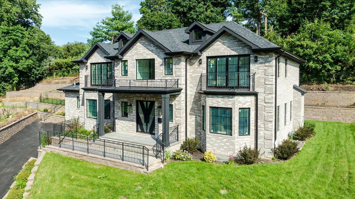 Stunning New Construction boasting 5000 Sq. Ft. of luxury living plus full finished basement located in Prestigious Saddle Rock Estates! A once-in-a-lifetime opportunity to own this exquisite Colonial on a private cul-de-sac in the heart of Saddle Rock Estates. Flooded with natural light and finished with top-tier craftsmanship, this elegant home welcomes you with a dramatic double-height foyer, leading to a formal living room, formal dining room, state-of-the-art chef’s kitchen, and a sun-drenched family room with floor-to-ceiling doors opening to a beautiful veranda. Main level includes a guest bedroom with full bath and a powder room. Upstairs features a luxurious oversized primary suite with spa-like marble bath and private balcony overlooking lush greenery. Three additional bedrooms each with en-suite baths, plus a convenient laundry room complete the second floor. The fully finished lower level offers a spacious entertainment area, full bath, and second laundry room. This home features an all steel structure, main floor has surround sound and full house central vac system. Prime location close to parks, shopping, recreation, and transportation. A must-see masterpiece!