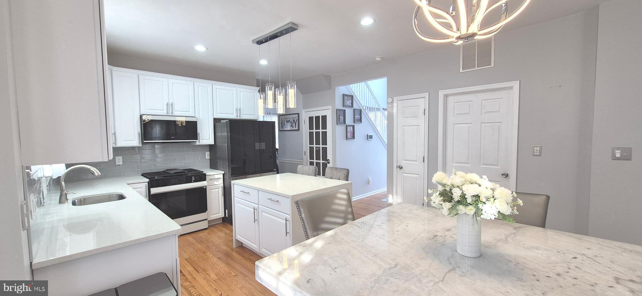 This exquisite and stately colonial style home is ready for its new owners! The owners have recently invested over 50k in upgrades! NEW RENOVATED KITCHEN with all new smart, high efficiency appliances to provide many years of enjoyment for the chef in you! Perfectly located on a corner lot in the desirable Wilton's Corner neighborhood of Winslow Twp.  The moment you walk through the main entrance you will soak in the thoughts of memories to be made here, with a warm and cozy feel, combined with style and elegance. The owners have carefully designed every room to accommodate a buyer who is particular in design, decor, colors, and space. The foyer features a vaulted ceiling with a custom crystal chandelier and beautiful lighting. Crown molding adorns the formal living and dining rooms, with chair railing and neutral wall colors that are warm and soothing. These colors were perfectly selected to accentuate any decor. These two formal rooms also include hardwood flooring, bay window, and easy flow from room to room. The well-appointed kitchen has been renovated and upgraded with gorgeous quartz counter tops and island, beautiful glass subway tile backsplash, modern fixtures, and the bonus is the new high efficiency smart appliances that will provide comfort and ease for many years to come with smart feature computer technology and firmware updates. Plenty of storage, food prep space, and a breakfast area for entertaining guests.  Just steps away is the large family room with a gas fireplace for those cold winter nights, and bright and airy natural lighting from the windows.  Access the rear yard from the breakfast room, to your private fully fenced in rear yard for outdoor fun during the warmer months. The corner lot location provides room to extend the fencing out should you choose to enlarge this area. On to the upper level of this gorgeous estate which features a primary suite that's sure to please with spacious his and her walk in closets, and a sitting area for quiet reading or meditating. You will love the NEWLY RENOVATED primary bathroom/en-suite with beautiful porcelain floors, a free-standing tub to relax in, separate stall shower, and double vanity sink with all new fixtures and lighting.  Three additional bedrooms are also included on this level, and each room is spacious providing ample closet space. A full hall bathroom with double vanity completes the upper level.  The space doesn't end here, it's on to the finished basement adding even more living area to enjoy. This lower level features a theatre room for fun movie nights, including speakers, chairs, and projector. It's also the perfect room for those sports games on the large screen, with the adjacent finished area providing plenty of room for you and your guests to hang out. Utilize this space for celebrations, games, or even an in-home fitness area or play area. A convenient half bath/powder room is also located on the lower level, and the bonus is a separate enclosed room for an office or 5th bedroom, so many options! This home also features a NEW ROOF and solar panels to save on those energy bills that are skyrocketing. You won't have to worry about water leaks or roof replacement as the 50 year warranty is transferable to the new owners for peace of mind. Major systems have all been replaced, furnace in 2023, hot water heater in 2021, and central AC unit in 2020, providing stress free maintenance for many years to come. This lovely home is within close proximity to major highways, AC Expwy, north/south freeway to Phila and shore points.  Plenty of shops, restaurants, and parks nearby. The community offers a clubhouse with an inground pool, tennis courts, basketball courts, and tot lots for its residents to enjoy.  You can have it all here at 18 Kelly Dr, so don't delay and schedule your private showing before the spring market arrives.