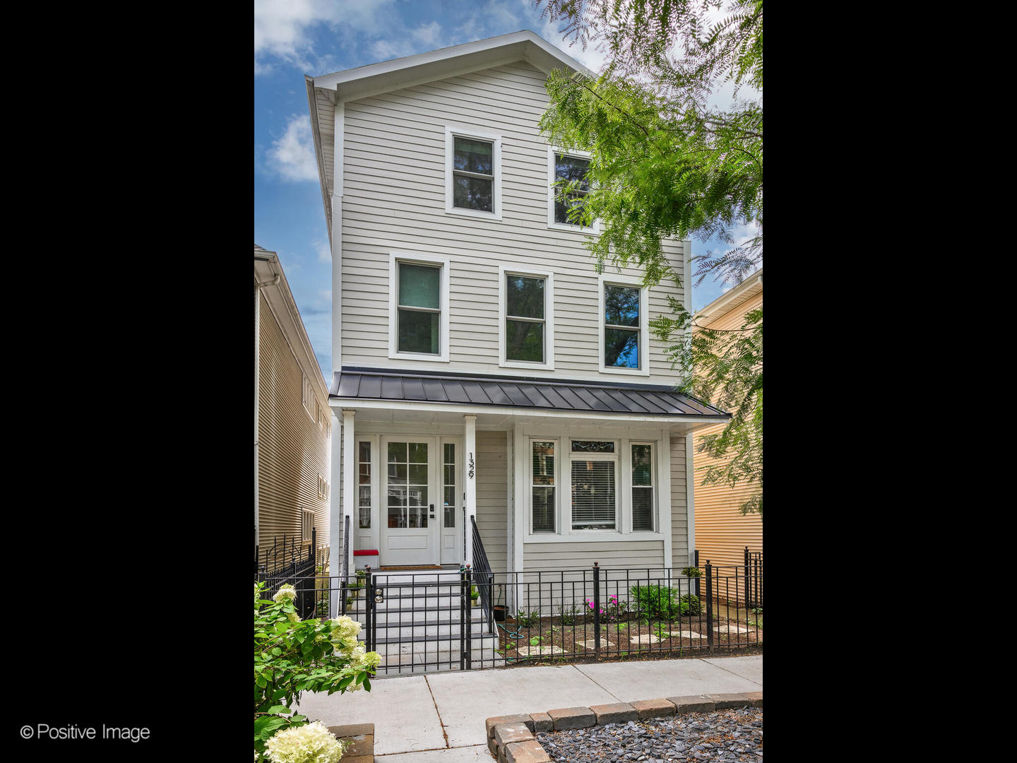Welcome to 1329 W Wellington Avenue, a beautifully reimagined 4-bedroom, 3-bathroom residence in the heart of Lakeview. Originally built in 1887 and thoughtfully updated in 2017, this remarkable three-story home blends timeless Chicago charm with modern sophistication.From the moment you step inside, you're greeted with sun-drenched living spaces, soaring vaulted ceilings, and gleaming hardwood floors throughout. The open-concept first floor is perfect for both entertaining and everyday living, with a spacious living room flowing seamlessly into a large dining area and chef's kitchen featuring stainless steel appliances, updated cabinetry, and ample counter space.The second floor is designed with families in mind, offering a large family room at its center, flanked by two generously sized bedrooms and a full bath. On the top level, discover a serene retreat with a private laundry area, fourth bedroom, and a luxurious primary suite boasting a spa-like bath, walk-in closet, and direct access to your very own private roof deck-ideal for morning coffee or evening sunsets. This home is brimming with thoughtful upgrades, including a recently updated cement fiber facade, many new windows, a brand-new garage with an epoxy floor installed in 2024, and updated baths. Even more impressive: the home is equipped with owned Tesla solar panels-a feature that not only reduces monthly utility costs but also provides long-term energy independence, eco-friendly living, and modern efficiency that buyers truly value in today's market. Step outside to enjoy multiple outdoor spaces, including a deck, roof deck, and beautifully maintained surroundings, all on a prime 25x95x105 lot.  Located within the highly sought-after Burley School boundary, this home places you in one of Chicago's most desirable neighborhoods with easy access to shopping, dining, parks, and transit. With its unique character, modern updates, and unbeatable location, 1329 W Wellington Ave is a rare opportunity to own a piece of Chicago history that's been transformed for today's lifestyle.