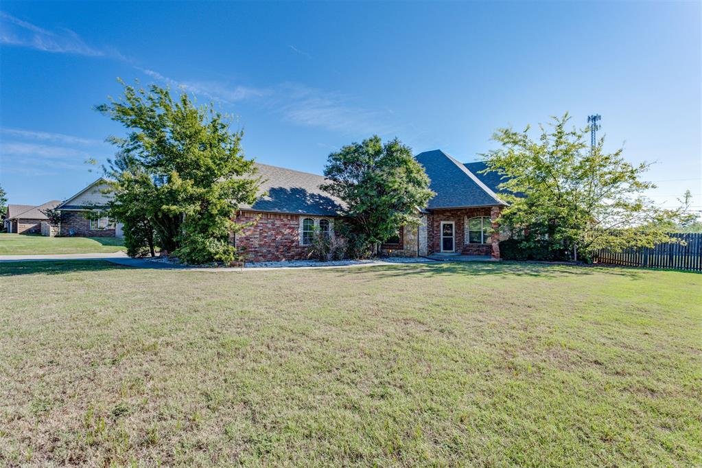 A beautiful home in a desirable, fully established, neighborhood! Featured in the 2009 Festival of Homes, this Davinci-Built home has some exquisite attention to detail. Beautiful granite entryway w/stunning faux finish, brick accents, tumbled stone & a barrel ceiling; home office w/built ins & beautiful wood floors + electrical in floor for versatile executive desk setup; formal dining w/custom drapes, hard wood floors & new carpet in bedrooms; laundry room w/handcrafted built-in mud bench; great sized kitchen w/granite countertops & custom maple cabinets, walk-in pantry, island w/wine storage, travertine tile throughout entire home; central vac system; living room has beautiful French villa cast stone gas log FP; Master suite has vaulted ceilings, add'l closet built ins & gorgeous double vanity. Movie room w/kitchenette, 1/2 bath & surround sound. Or make the movie room the perfect nursery or mother-in-law space! The home sits on a large lot backing up to Penn Ave., has a massive patio w/outdoor grilling area and storm shelter inside the 3 car garage!