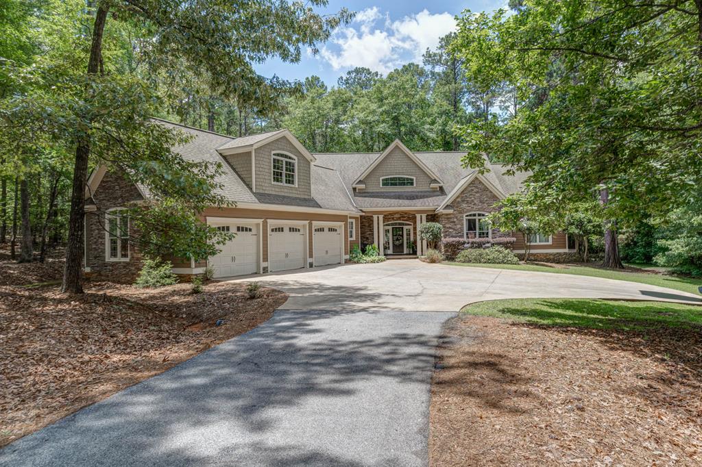 A beautiful custom home located on a quiet cul-de-sac in the gated Piedmont Lake community. Situated just two miles from I-185 at Exit 34, this location offers a central commute while remaining secluded from noise and traffic. As part of Harris County's premier neighborhood, the property offers access to a 212-acre fishing lake, a neighborhood pool, a playground, a marina, and soft-surface tennis courts. The home features: Four spacious bedrooms (one currently configured as a home office). Three full baths.  A large bonus room over the garage providing versatile flex space. High-speed AT&T fiber optic internet. A stunning primary suite with large windows and woodland views.  Outdoors find a three bay garage, spacious paved parking, firepit area and covered stacked stone fireplace!