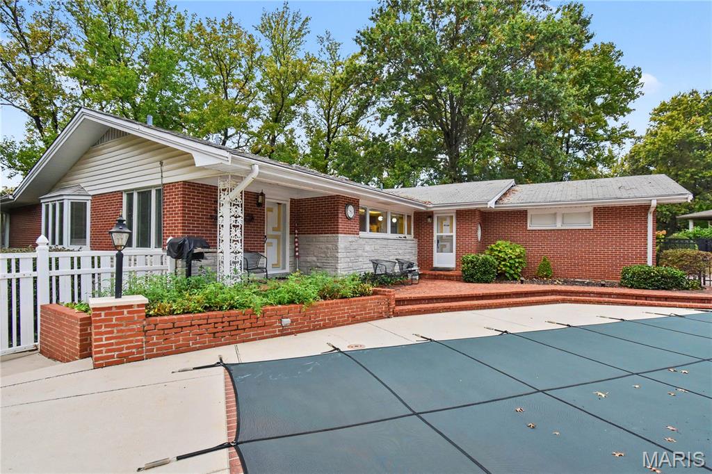 Exceptional opportunity in the highly sought-after Ladue School District! Situated on a beautiful, expansive over one half-acre lot in the heart of Creve Coeur, 301 N Graeser Road is a lovingly maintained brick ranch offering timeless charm and incredible potential. This 3-bedroom, 2.5-bath home features approximately 1,800 square feet of main-level living space, two fireplaces, and a full basement offering additional possibilities. The true highlight is the exceptional outdoor setting, complete with a private in-ground pool, charming gazebo, and spacious yard ideal for relaxing and entertaining. Lovingly cared by its current owner for over 50 years, this home presents a wonderful opportunity to preserve its original character while adding modern updates and significant value. With its desirable lot, established location, and tremendous renovation potential, this property offers a rare opportunity to build equity in the prestigious Ladue School District. Conveniently located near shopping, dining, parks, and major highways, this is your chance to make a truly special property your own!