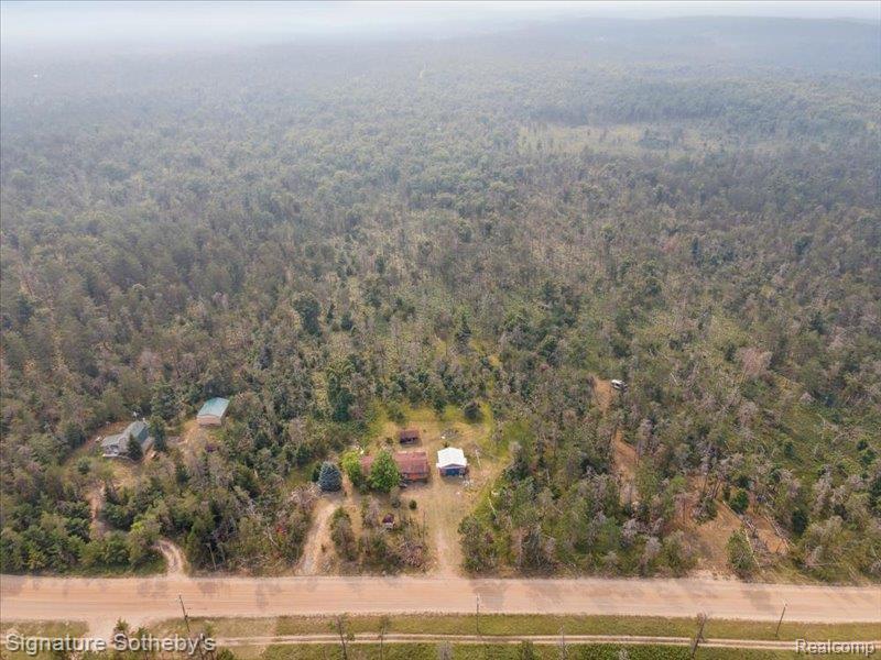 10 Secluded Acres – Surrounded by Nature and Endless Possibilities. Discover the perfect blend of privacy and potential with this fully furnished home, nestled on 10 expansive acres and bordered by hundreds of additional acres for unparalleled seclusion. Located across the street from state land, this property offers direct access to outdoor recreation, making it a dream for hunters, nature lovers, or anyone seeking a private retreat away from the main road. Fully Furnished Home is on the property and a spacious barn on the property adds flexibility for storage, hobbies, or agricultural use. Whether you're looking for a peaceful getaway or a full-time residence surrounded by natural beauty, this property delivers. Home is being sold "as is".