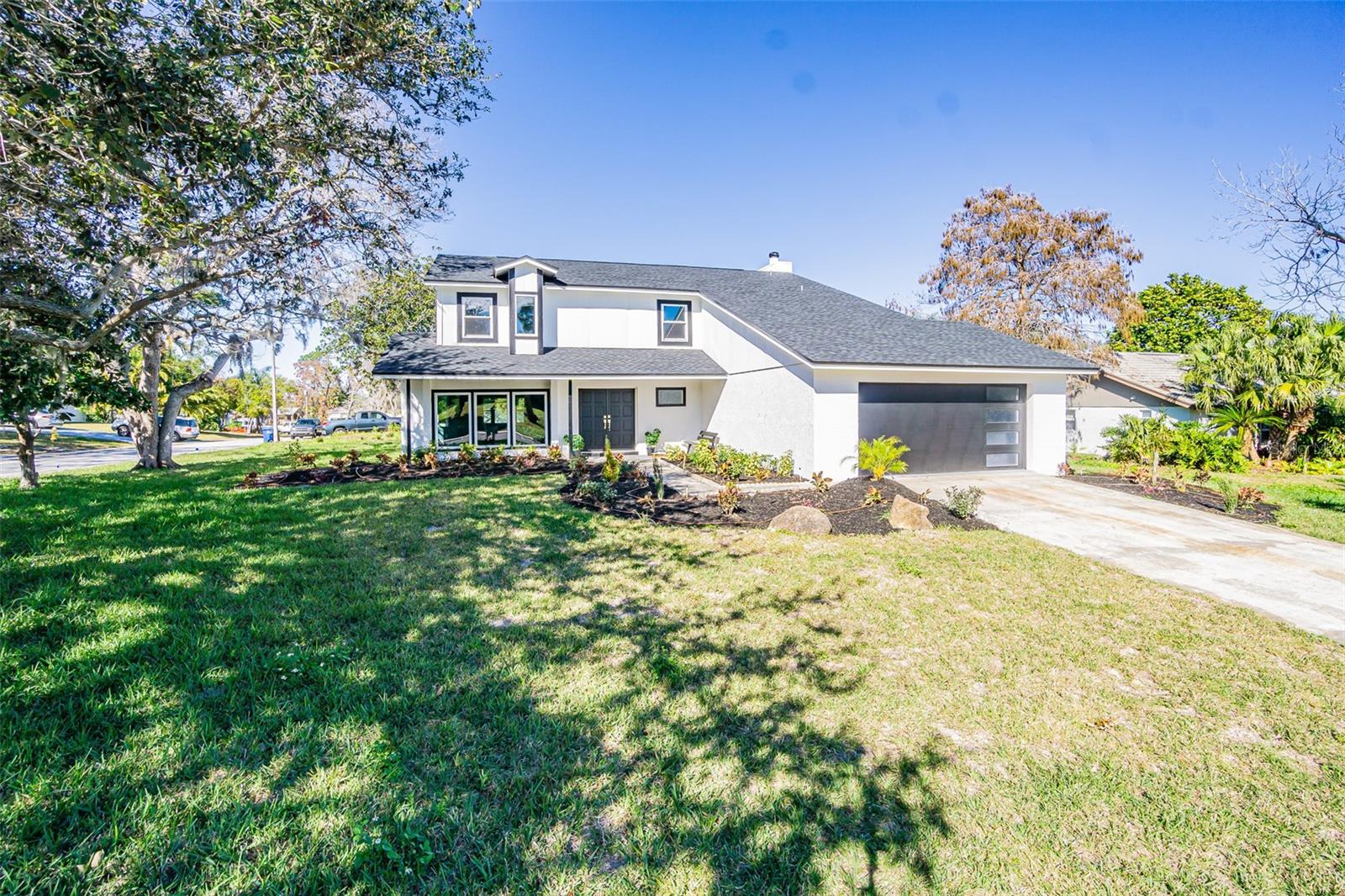 Welcome to your dream home! This stunning 4-bedroom, 3-bathroom property is situated on a spacious corner lot with an oversized yard, perfect for outdoor activities, gardening, or even a future pool. The home features brand-new tile flooring on the main level, while the upstairs boasts the warmth and elegance of wood flooring. The completely remodeled kitchen is a chef’s delight, featuring state-of-the-art appliances, modern finishes, and a large island ideal for meal prep and entertaining. Each of the three bathrooms has been beautifully updated with contemporary fixtures and stylish tile work. Recent upgrades include a new roof and a new AC unit, providing peace of mind and energy efficiency for years to come. A spacious 2-car garage offers ample storage and convenience, while the back porch provides a relaxing space to enjoy the outdoors. This home combines modern amenities with ample space and is located in a desirable neighborhood, making it perfect for families or anyone who loves to entertain. Don’t miss the opportunity to make this exceptional property your own—schedule a tour today!