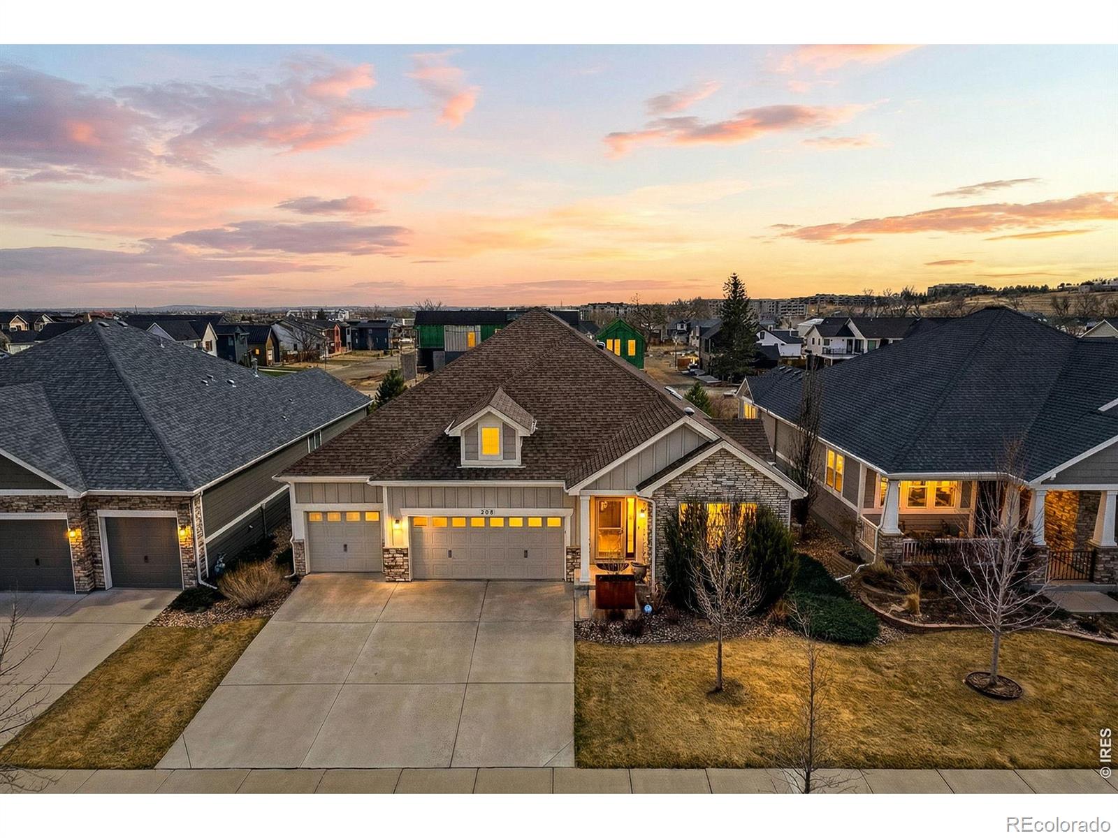 An exceptional offering in Coal Creek Crossing, this residence represents a rare combination of architectural presence, refined finishes, and a setting that is nearly impossible to replicate. Thoughtfully designed on a premium lot, the home delivers expansive living spaces, seamless functionality, and a level of quality that stands apart in today's market. Inside, the home unfolds with a bright, open layout designed to capture natural light and create effortless flow between living, dining, and kitchen spaces. The heart of the home is a well-appointed kitchen featuring custom cabinetry, premium appliances, and a generous workspace, all opening to inviting gathering areas ideal for everyday living and entertaining. Large windows and intentional design elements create a warm, connected feel throughout while still offering defined, comfortable spaces. Extending off the main living area, an expansive covered outdoor deck creates a true indoor-outdoor connection for year-round enjoyment, dining, and entertaining. The upper level provides a private retreat with a spacious primary suite, well-designed bath, and ample closet space, along with one additional bedroom positioned for privacy and flexibility. The finished lower level expands the home's versatility and includes an additional full bedroom with its own ensuite, ideal for guests or multigenerational living, plus flexible space for a media room, fitness area, or additional living space. Located in Original Town Superior, the home offers immediate access to trails, open space, and parks connecting to Coal Creek. Walkable to Whole Foods, Target, Costco, and a variety of restaurants, the location blends everyday convenience with an outdoor-focused lifestyle. With a three-car garage, extensive updates, and a thoughtfully designed floor plan, this is a rare opportunity in one of Superior's most sought-after neighborhoods.