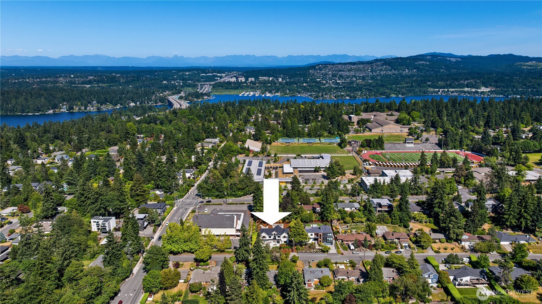 Aerial view showcasing the home's prime location near the lake and mountains