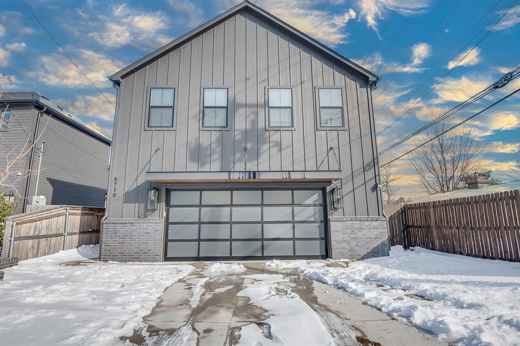 Welcome to a truly one-of-a-kind modern property in the heart of Oklahoma City, offering an exceptional blend of style, flexibility, and functionality. Built in 2023, this contemporary residence features a stylish 2-bedroom, 1-bath main home with an expansive open-concept layout ideal for both entertaining and everyday living. The kitchen serves as a striking focal point, highlighted by a granite waterfall island with seamless edges, modern contemporary cabinetry, and sleek finishes. Engineered wood flooring flows throughout the main living areas, adding warmth, durability, and a refined modern aesthetic.Enhancing the property’s versatility is a separate first-story 1-bedroom, 1-bath apartment with its own private entrance—perfect for guests, extended family, a mother-in-law suite, or potential rental income. Below it all lies an extraordinary heated and cooled 6+ car garage/workshop totaling approximately 1,578 sq ft MOL, finished with durable epoxy resin flooring and offering exceptional space for car enthusiasts, hobbyists, small business owners, storage, or flexible use rarely found in residential properties.Designed for low-maintenance living, the exterior features gravel landscaping and artificial grass, minimizing upkeep while maximizing convenience. The property is also backed by a gas-plumbed whole-home generator, providing added peace of mind, and comes move-in ready with all kitchen appliances plus a washer and dryer included.Seller has an appraisal on file validating approximately 3,447 sq ft of gross living area; however, the listing square footage reflects courthouse records showing 1,869 sq ft of GLA. Buyers to verify the square footage to their satisfaction.Located in a prime OKC neighborhood just minutes from top dining, shopping, and entertainment, this exceptional property stands out as a rare combination of modern design, functional living spaces, and unmatched versatility. The listing agent manages the property’s owning entity.