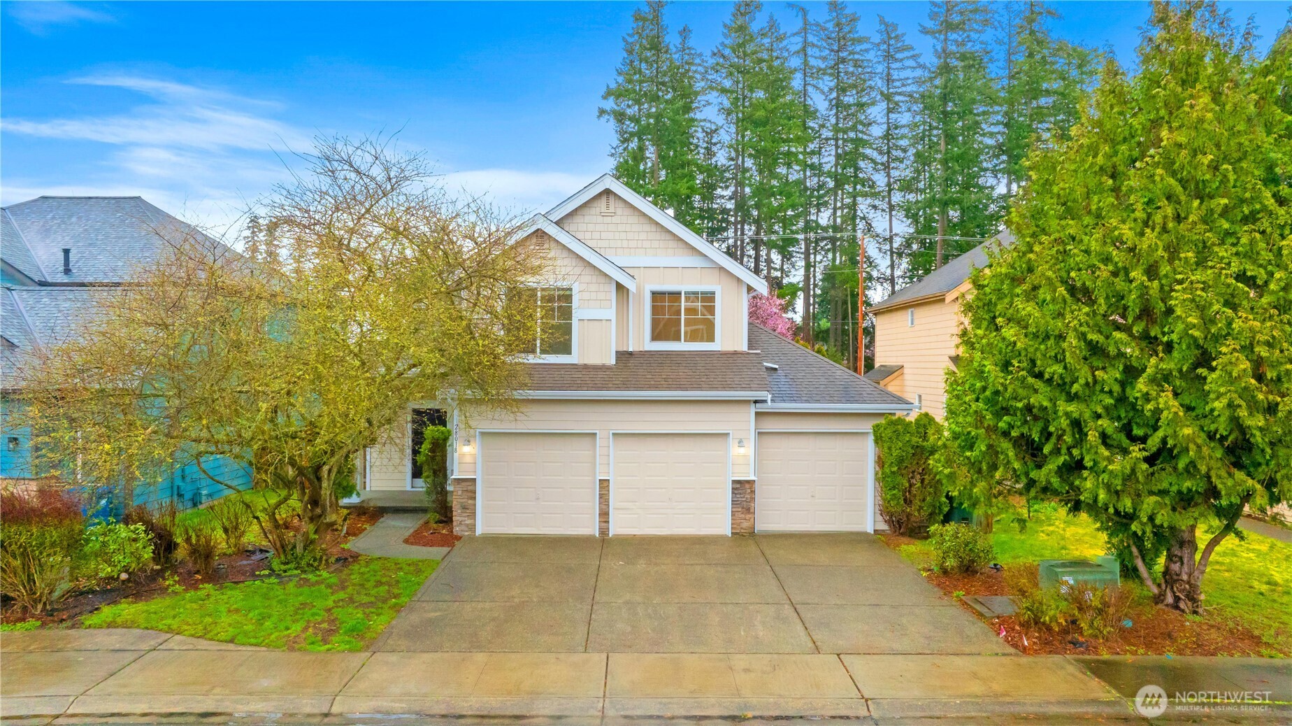 Welcome to this beautiful, well-maintained two-story home nestled in the desirable Hunter Oaks community. Thoughtfully designed for comfortable everyday living, the main level features a bright and inviting family room with vaulted ceilings, skylights that fill the space with natural light, built-in shelving, and a cozy fireplace. A separate living room with its own fireplace offers additional space to relax or entertain. The kitchen features a walk-in pantry and plenty of workspace for meal preparation and hosting. A formal dining room, powder bath, and dedicated laundry room complete the main floor. Upstairs, you'll find a versatile bonus space, the spacious primary suite with a five-piece ensuite bath, and two additional bedrooms and a full bathroom. Step outside to enjoy the fully fenced backyard with patio—perfect for outdoor dining, relaxing, or entertaining—along with the added convenience of a three-car garage offering plenty of storage and parking.