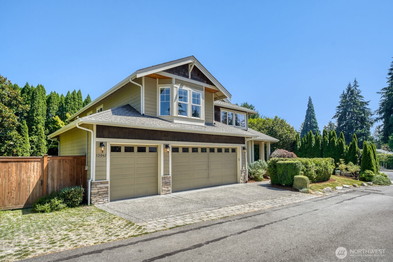 Nestled in the sought-after Wilburton neighborhood, this beautifully crafted Craftsman offers timeless elegance and exceptional livability. A grand two-story foyer welcomes you with soaring ceilings, rich hardwood floors, extensive millwork, and abundant natural light. The thoughtfully designed floor plan features formal living and dining rooms, a private main-floor office with custom built-ins, and spacious gathering areas ideal for everyday living and entertaining. The chef's kitchen boasts granite slab countertops, a large center island with gas cooktop, stainless steel appliances, abundant cabinetry, and a sunny breakfast nook that opens seamlessly to the family room with a cozy fireplace. Upstairs, generous bedrooms provide comfort and privacy, including a luxurious primary suite. Enjoy beautifully landscaped grounds and inviting outdoor spaces perfect for relaxing or entertaining. Ideally located minutes from Downtown Bellevue, Bellevue Collection, Microsoft, Amazon, light rail, parks, top-rated Bellevue schools, and easy access to I-405 and SR-520. A rare opportunity to own an exceptional home in one of Bellevue's most convenient and desirable neighborhoods.