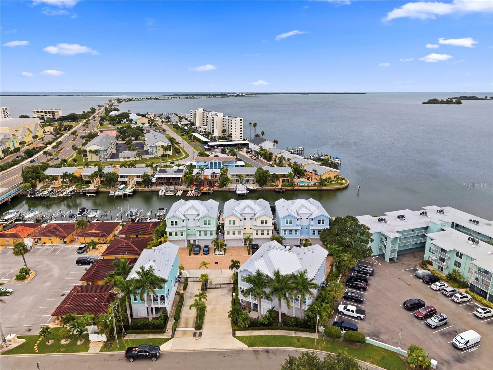 Stunning waterfront townhouse in beautiful Dunedin, offering exceptional Gulf views and direct canal frontage with a private boat slip. This spacious 3-bedroom, 3-full-bath residence features a spacious en-suite primary bedroom, an elevator for effortless access to all levels, and an impressive open layout designed to capture the surrounding water views. Enjoy breathtaking sunsets, boating access, and the best of the Florida waterfront lifestyle from your own home. Beautifully appointed and truly special, this exceptional property offers a rare combination of luxury, convenience, and coastal living in one of Dunedin’s most desirable settings.The main living level features high end Bosch appliances, quartz countertops, and a private balcony overlooking the canal with views of the Gulf. With its private boat slip, beautiful Gulf and canal views, proximity to the beach and downtown Dunedin this townhouse offers the perfect blend of comfort, convenience and waterfront living.