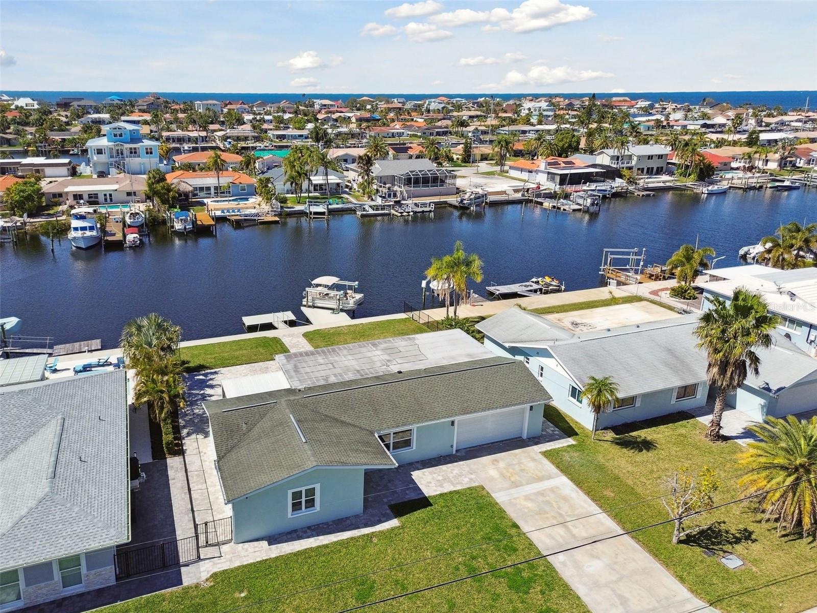 SELLER IS ACCEPTING ALL OFFERS! Completely remodeled waterfront home located in the desirable Gulf Harbors community—just a 15-minute boat ride to the open Gulf. With no HOA and optional access to a private beach, this turn-key property offers the ultimate in Florida waterfront living. Sitting on a spacious 9,375 sq ft lot, there’s plenty of room to add a custom pool.

Inside, the open floor plan features 3 bedrooms, 3 full bathrooms, a combined living and dining area, and a screened Florida patio. The home has been fully updated with fresh exterior paint, brand-new interior finishes, all new windows, a 2025 HVAC system, and a 2025 hot water heater. The kitchen includes new cabinetry, Corian countertops, a new sink, and new dishwasher. All bathrooms have been upgraded with new vanities and fixtures. New sliding doors open from the living room to a large backyard patio with newly installed pavers, ideal for outdoor entertaining.

The property also features a newly installed 2023 13,000 lb boat lift and a 2022 floating dock. Gulf Harbors offers exceptional amenities, including access to a private beach club on the Gulf, boat ramps, a yacht club, and nearby riverfront restaurants. Optional memberships are available for the private beach at $200 annually and for two private boat slips at $140 annually. This home is conveniently located near shopping, dining, medical facilities, and major highways, offering the perfect blend of luxury, comfort, and location.