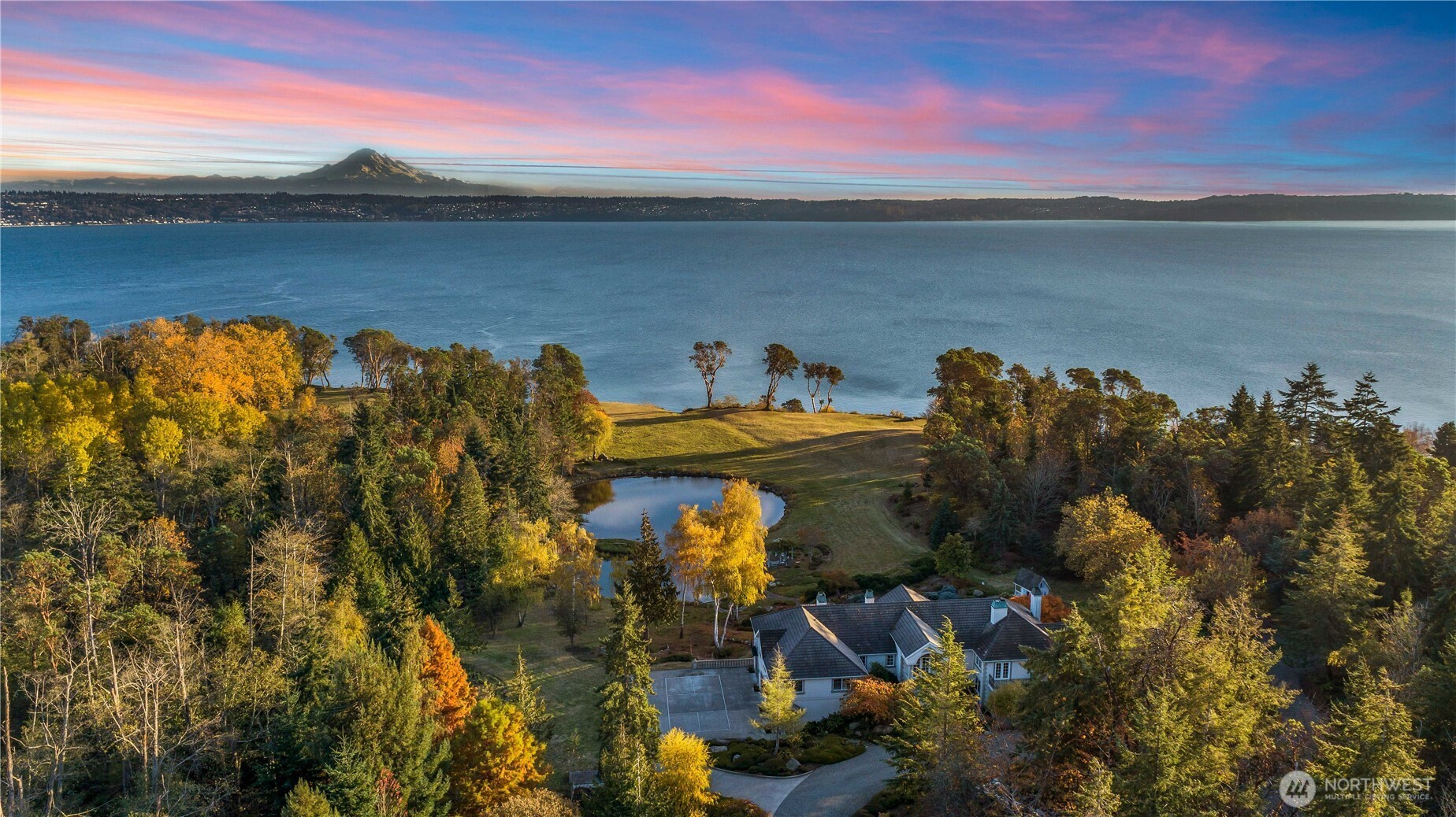 A once in a lifetime opportunity to own an exclusive, gated, waterfront estate! Just over 21 acres overlooking the sound with an unobstructed view of Mt Rainier! Along with 500 ft of private beach! The property features a beautiful main home with 3 bedrooms, an office, 4 & 3/4 bathrooms, and a 3 car garage! The lower level features a large media room, 2nd kitchen, high ceilings, indoor pool, elevator, and the list goes on! The massive barn also features two additional and separate guest units. A 1 bedroom with one bathroom, as well as a studio with a 3/4 bathroom. Here you'll also find stables, a tack room, and a main area for storage or farm equipment. The possibilities are endless at this one of a kind oasis!