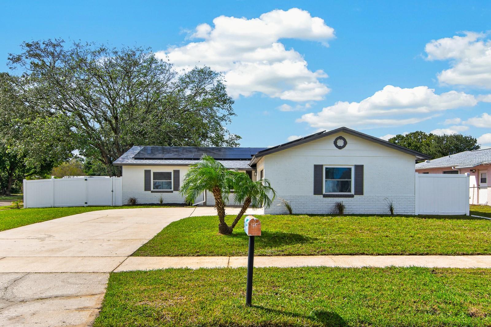 BEAUTIFULLY RENOVATED, MOVE-IN READY, AND PACKED WITH UPGRADES! Welcome home to this stunning 3-bedroom, 2-bathroom residence situated on a spacious corner lot with NO HOA and NO flood insurance required! Thoughtfully renovated from top to bottom, this home offers the perfect combination of modern finishes, comfortable living, and everyday convenience. Step inside to discover a bright, inviting interior featuring fresh neutral tones, beautiful wood-look flooring, updated lighting, and a spacious, open-concept living and dining area that's perfect for both relaxing and entertaining. The gorgeous, completely updated kitchen is sure to impress, showcasing crisp white shaker-style cabinetry, sleek quartz countertops, a stylish subway tile backsplash, stainless steel appliances, a modern black faucet, and a large center island offering additional prep space and seating. The thoughtfully designed split-bedroom floor plan provides added privacy, with a comfortable primary suite featuring its own beautifully updated bathroom and walk-in closet. Two additional bedrooms offer flexibility for family, guests, or a home office, while the second updated bathroom features fresh, modern finishes. Additional highlights include a ROOF JUST 2 YEARS OLD, FULLY PAID-OFF SOLAR PANELS, and an attached 2-CAR GARAGE! Outside, the generous corner lot offers plenty of outdoor space and possibilities, while the fenced backyard provides room for pets, play, gardening, or creating your own outdoor retreat. With no HOA restrictions, you'll enjoy added freedom and flexibility. From the stylish interior renovations to the energy-saving benefits of owned solar panels, this home has so much to offer! Why wait for new construction when you can enjoy the look and feel of a newly renovated home that's ready for you today? Schedule your private showing and come see everything this incredible property has to offer!