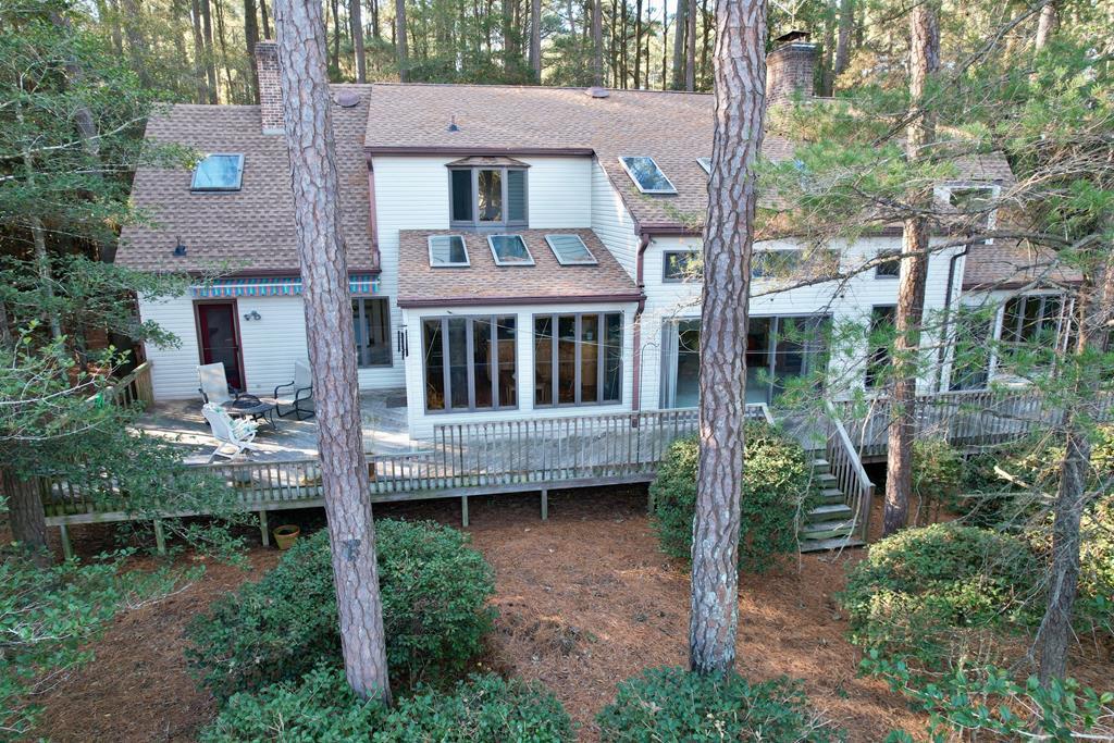 Open house, 7/5 10-12:00.  Looking for a spacious home with plenty of room for guests in a tranquil location?  This Folly Creek waterfront home boast 5 bedrooms, 3 1/2 baths (1000 gal septic) situated on 1 acre near the community dock.  Just a short spin or paddle to Barrier Islands to fish, swim and/or sunbath.  The first floor primary suite features an attached sunroom, office/den, luxurious ensuite and access to the rear deck!  The 2nd floor boasts 4 bedrooms, 2 full baths and an open lounge/2nd living room.  Captivating views of Folly Creek from most rooms.  3 fireplaces with Vermont Casting wood stove inserts, central vacuuming system, on demand hot water heater and whole house generator are just a few of the many upgrades you will find in this well thought out custom built home.
