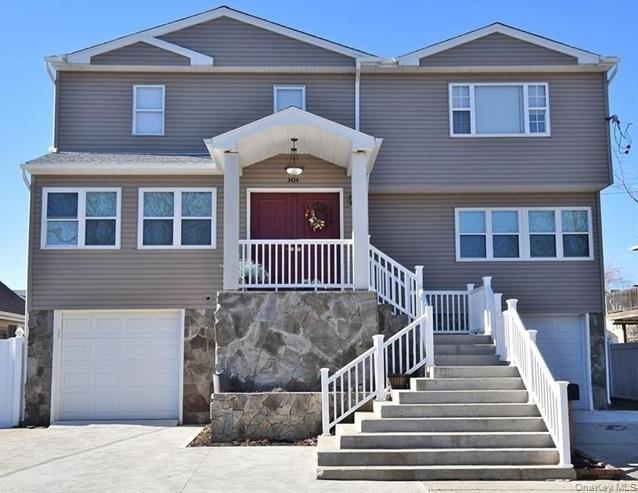 Contemporary three-level, waterfront home. Concrete basement has been raised eight feet and can fit five cars. Three separate entrances with interior elevator that is accessible to all three floors. House was architecturally rebuilt (not remodeled) and finished beautifully within the last eight years. Home includes: six bedrooms, three bedrooms, two designer kitchens, and an attic. Internal speakers and fire alarms already installed in the ceilings. 3100 square feet of living space.