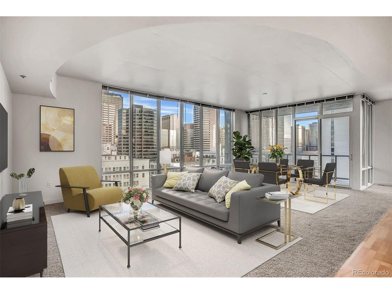 BEAUTIFUL DOWNTOWN VIEWS IN A CORNER RESIDENCE! This spacious 2-bedroom / 2.5-bathroom SPIRE home has nearly 1,700 square feet of living space in a wide-open floor plan framed by soaring ceilings and floor-to-ceiling windows. Perched 12 floors above Downtown Denver with walls of glass, this corner condo is flooded with cheerful natural light. Cook's kitchen with slab granite island + countertops, sleek stainless steel appliances, and custom tile-work. Retreat to the primary suite with incredible views, a 5-piece primary bathroom with frameless shower and dual sinks, and a walk-in primary closet. This home offers plenty of privacy with 2 bedrooms on opposite ends of the home, each with a full bathroom. After a long day of working or shopping, head out to the oversized balcony with a glass of wine and you'll swear that you're suspended in midair! Also included: 1 automobile parking space and 1 storage space in the attached garage. A second parking space is available for an additional fee. Come view this home again at night to truly appreciate the spectacular city views! SPIRE is FHA-approved. Immerse yourself in the vibrant 42-story SPIRE community, complete with LEED certification, a pool, hot tub, health club, multimedia lounge, and theater. Your four-legged companion will love the dedicated dog park, and the grilling area is perfect for entertaining. Benefit from 24-hour courtesy desk service, guest suites, and a modern access control system. Embrace the downtown lifestyle and make this SPIRE residence, which has served as a cherished second home, your own. Come home to Downtown Denver's SPIRE--life is better here! SPIRE Denver has super fast internet-1 gig dedicated to each condo. Fastest downtown! Come home to Downtown Denver's SPIRE -- life is better here! Photos featuring furniture have been virtually staged.