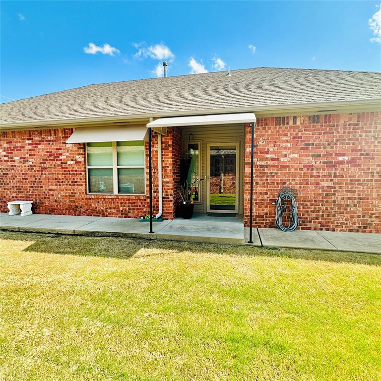DON'T MISS THIS MUST-SEE HOME! This lovely home Iocated in the gated community of Santa Fe Villas II has been completely updated.  It offers a large living room with beautiful flooring and brick fireplace.  The primary bedroom is large with a huge walk-through closet connecting to the spacious laundry room. This home has all the extras including new stainless steel appliances, granit countertops throughout the home with new fixtures.   The enclosed patio has heat and air and is perfect for morning coffee or could be a home office.  The uses are limited to your imagination.  In the garage, you will find a large custom-built above-ground storm shelter for the Oklahoma storm season.  For your added safety and convenience there is a whole-home Generac Generator to ensure you are never without power.  Adding additional beauty, there are awnings on the exterior of the home over the windows.  The storage here is abundant.  This is a gated community with large ponds with fountains conveniently located near I-240, i-35 and I-44, making your commute to and from work quick and easy with shopping and entertainment just minutes away. Don't miss your opportunity to own this great home.  This home has been well-maintained and won't last long! HOA mows front and back yard, along with maintaining all the greenbelt common areas; however, the backyard here is turf,  The seller is leaving the refrigerator. The orange cabinet in the garage is reserved along with the seller's personal items.  The buyer is to verify the schools.  Schedule your tour today. Professional photos to follow.