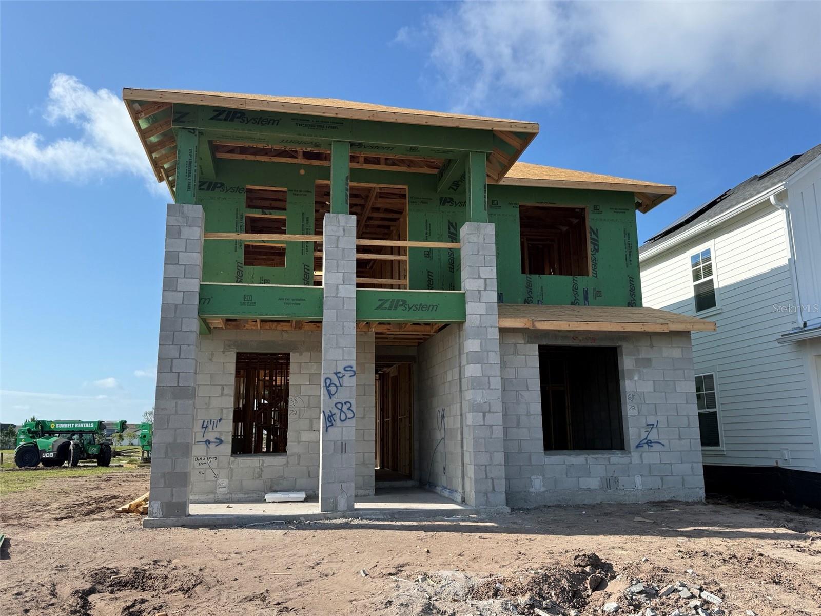 Under Construction. Not all new construction is created equal. This beautifully crafted custom residence showcases the difference that comes with a true custom builder, where thoughtful design, elevated finishes, and flexible living spaces come together to create a home that lives as beautifully as it looks. Designed for both entertaining and everyday comfort, the open-concept floor plan centers around a spacious kitchen with an oversized island, flowing effortlessly into the dining and living areas. Expansive sliding glass doors invite the outdoors in, opening to a covered lanai and an extended covered breezeway that creates a charming connection between the main home and detached garage while providing additional space to relax, gather, or enjoy Florida's beautiful weather. The private first-floor owner's suite offers a peaceful retreat, while additional bedrooms and flexible living spaces provide room for family, guests, hobbies, or working from home. Upstairs, a generous bonus area is ready to become your media room, game room, fitness space, or whatever best fits your lifestyle. Above the garage, you'll find a private one-bedroom, one-bath apartment complete with its own kitchen. Perfect for multi-generational living, long-term guests, a private home office, or potential rental income, this versatile space adds tremendous value and flexibility. Located in the award-winning Laureate Park community, residents enjoy a lifestyle that's hard to match, with resort-style aquatic amenities, fitness facilities, tennis and pickleball courts, miles of walking and biking trails, community events, neighborhood dining, and included high-speed fiber internet. Just minutes from Lake Nona Medical City, Orlando International Airport, and everything Lake Nona has to offer, this home delivers the perfect blend of luxury, convenience, and customization.