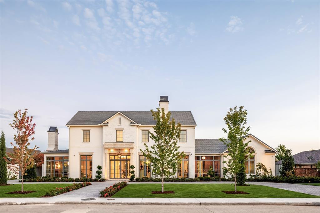 Nestled in Preston Hollow, 5610 Lobello Drive is a newly constructed Georgian-inspired estate built by Pierce Jordan Development that epitomizes timeless Southern elegance. Spanning 7,890 square feet on a meticulously landscaped half-acre lot, this home offers a harmonious blend of classic design and modern amenities, making it an ideal sanctuary for family living.The residence features five generously sized bedrooms, six full bathrooms, and two powder rooms, ensuring comfort and privacy for every family member. Classically scaled rooms are designed for both formal and informal entertaining, with interiors showcasing marble, limestone, and wide-plank wood flooring. Custom cabinetry and hand-troweled plaster finishes add to the home's sophisticated ambiance. A chef’s kitchen equipped with Thermador appliances and luxurious marble countertops serves as the heart of the home. The gracious primary suite includes a private coffee bar, a luxurious marble-clad floating tub, and a dressing room with an additional laundry closet, providing a serene retreat within the home. Designed to accommodate modern lifestyles, the home features a study, game room, office, den, and a lounge with a bar, offering versatile spaces for work and leisure. The property includes a 40-foot-long pool and spa, an outdoor kitchen, and a gracious indoor loggia leading to a covered outdoor terrace, perfect for alfresco dining and relaxation. This property's timeless design and thoughtful amenities offer a harmonious blend of elegance and practicality, making it the perfect home for families seeking both beauty and functionality.