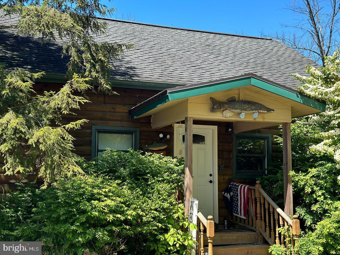 Super Motivated Seller, Bring Offers, So many possibilities, seller willing to subdivide  and sell the barn and some acreage off.there is a 8,350.  square foot pole barn/ warehouse  temerature controlled , includes finished office with a bathroom and roughed in for shower.  Great setup for an Airbnb Hunting cabin or camping area less than 5 miles to shopping ,  Log cabin is 2689 Sq Ft with an inlaw suite. over looking the pond.this is also grandfathered for Residential , any questions fell free to call listing agent