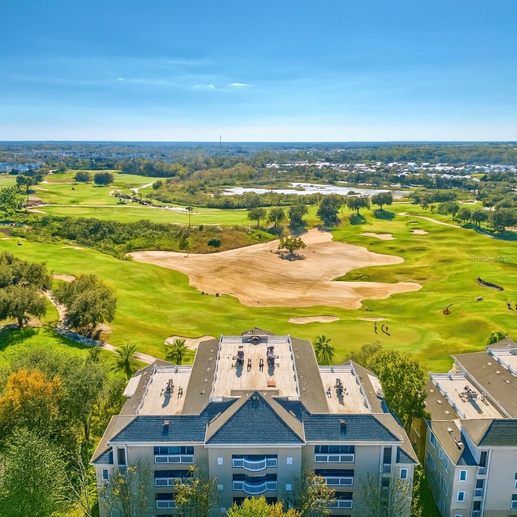 Fabulous top-floor condo with stunning golf course views!Located in an elevator building, this spacious 3-bedroom, 3-bath residence features an open floor plan and a large private balcony overlooking the beautifully maintained fairways. The kitchen offers generous counter space, stainless steel appliances, and breakfast bar seating—perfect for both everyday living and entertaining. Elegant touches like crown molding add a refined finish throughout.Situated within the renowned Reunion Resort, members enjoy access to three Championship Signature Golf Courses, including designs by Jack Nicklaus, Tom Watson, and Arnold Palmer. Resort-style amenities include multiple pools, playgrounds, walking trails, and more—providing the perfect blend of luxury, recreation, and convenience.This is the ideal opportunity to own a top-floor home with exceptional views in one of Central Florida’s premier golf communities!