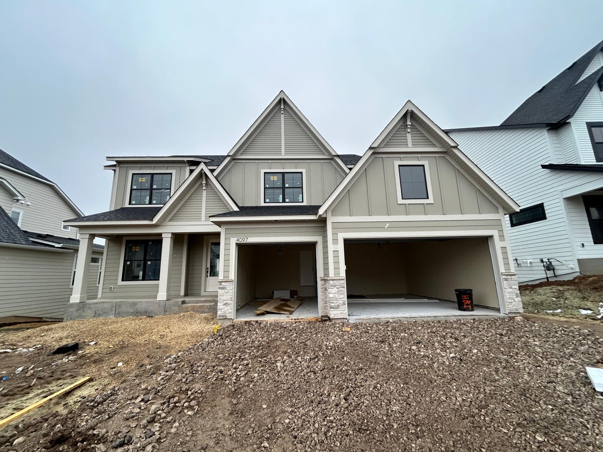 Hanson Builders—backed by over 45 years of homebuilding excellence in the Twin Cities—proudly presents the Hillcrest Sport. Located in highly sought-after Arbor Ridge, this beautifully designed home offers an exceptional layout featuring four bedrooms plus a spacious bonus room on the upper level, a convenient second-floor laundry, and a Jack-and-Jill bath. The main level includes a private study and a stunning gourmet kitchen with expansive space for cooking and entertaining. The finished walkout lower level adds even more living area and includes a highly sought-after sport court. Thoughtful architectural details and abundant windows throughout the home provide impressive natural light and a warm, inviting feel. Arbor Ridge offers outstanding neighborhood amenities, including a community pool, park, and walking trails. The neighborhood is in its closeout phase, and this home is scheduled for completion in April.