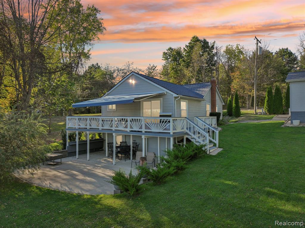 PRICE IMPROVEMENT! Enjoy vacation-style living every day at this charming lakefront home on peaceful Miller Lake. Nestled on a spacious double lot, this property features two docks (one powered) and a large sandy beach perfect for swimming, boating, kayaking, and fishing right off the dock in summer—and skating or ice fishing in winter. Whether you’re seeking a comfortable year-round home, a weekend “Up-North” retreat just 75 minutes from Metro Detroit, or a high-demand Airbnb/VRBO investment, this place checks every box for relaxation, recreation, and rental potential. Two garages provide all the storage you could ever need: a heated 2.5-car garage with extra depth and professional shelving, plus a newer insulated 1.5-car steel garage with electricity ideal for lake gear and toys. Inside, you’ll find a bright open kitchen and dining area, three comfortable bedrooms, and a spacious living room with a doorwall leading to the deck—complete with a Marygrove retractable awning for shade and effortless outdoor living. The walkout lower level offers flexible space for storage, a workshop, or a cozy lounge area, opening to a large patio perfect for entertaining or unwinding with peaceful lake views.