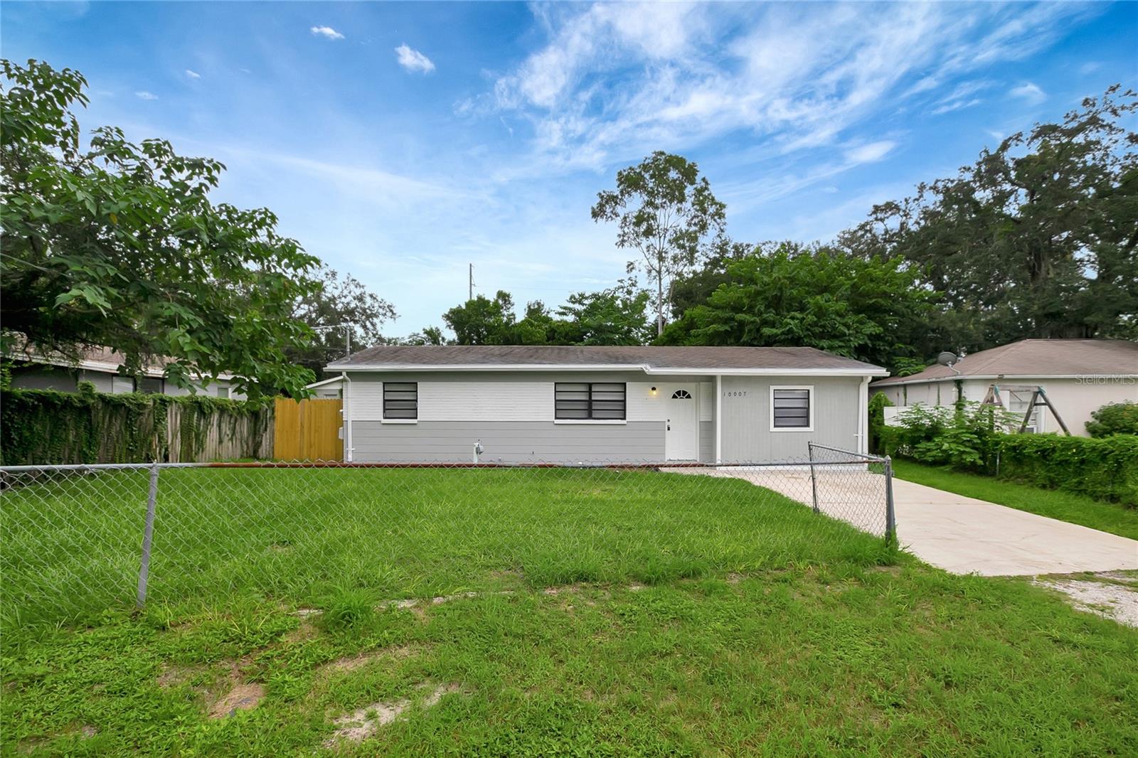 NOTE: home was staged for photos only. Nice 4 Bed/2 Bath, single-family home in Tampa with over 1,400 sqft. Centrally located kitchen with ample cabinetry and countertops. Nice floorplan with good-sized rooms. Ceramic flooring in main living areas for durability and longevity and new carpet in some of the bedrooms. Primary bedroom offers an attached bathroom and double built-in closets. Fenced lot with plenty of room for enjoyment. Many bonus features such as inside laundry, both a living room and a family room, and ceiling fans to send you a cool breeze. Great location with easy access to everything you need. Don't make a decision without seeing this home first!