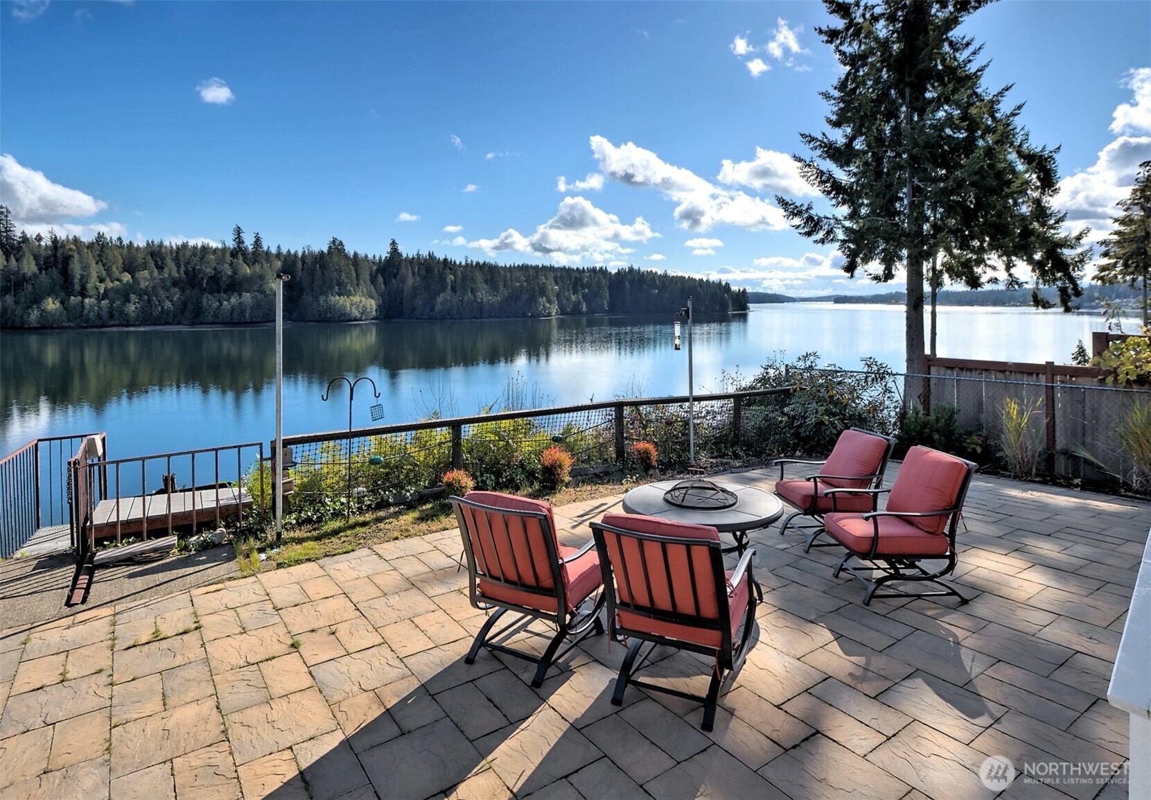 TRULY INCREDIBLE views from this South Puget Sound Waterfront property! Sweet location on Pickering Passage, 180 degree views of Harstine Island & Jarrell's Cove Marina. Ninety feet of gravel beach with new bulkhead & a boathouse (a project but it's grandfathered in). Expansive paved patio & firepit at house level. Stair access to beach, plus electric lift for transporting gear up & down. The home is roomy & open with big windows & woodstove. Detached single garage with a bonus game room. Additional shed houses well tank and storage space. Fully fenced, concrete driveway. Short term rentals allowed. Come take a look!!