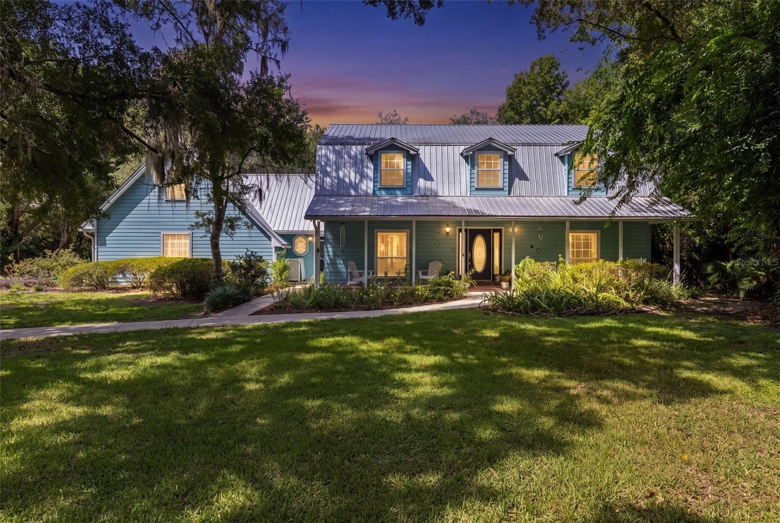 Welcome to your 1 ACRE Paradise right off of Markham Woods Road! Enjoy the ultimate in privacy as you are completely surrounded by mature landscaping and a canopy of shady oaks! The elegant front porch and butterfly garden creates the most welcoming atmosphere as you prepare to  enter this spectacular 4 bedroom 2 Full bath and 2 half bathrooms home! As you pass by the formal living room and dining room you will immediately notice the perfectly curated pool area through the windows and French doors. It's almost as if the natural springs flow through your backyard with the cascading waterfall and the saltwater filtration system, which is the perfect touch for all your swimming guests! With so much land included, your adventures will never end as there is so much to see and explore. So many updates through the years but within the last 5 years the whole house has been repiped, master & guest bathrooms renovated, water heater replaced, along with a new electrical panel and a plug attachment for your generator! All the bedrooms have more than enough space and you even have a private verandah right off the master suite to enjoy your morning cups of coffee with an elevated view of your oasis. Plenty of room for all your vehicles to with the three car garage. Don't let this gem of Hanover Woods get away from you. Call to schedule your tour today!