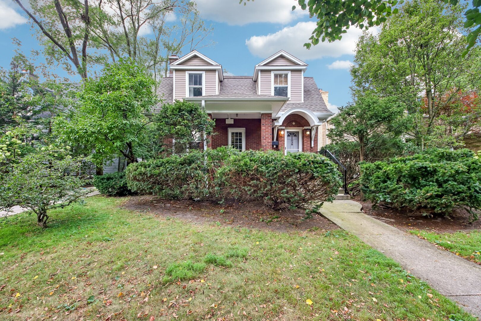 Beautifully updated vintage home on a quiet, one-way loop in NW Evanston offers classic character, flexible living space, and thoughtful improvements. The gracious living room features built-ins and a wood-burning fireplace and opens to a formal dining room.  Maple-and-granite kitchen with stainless appliances connects to the large family room with a pass-through for convenient entertaining and everyday living. The family room flows into a high-ceilinged sunroom addition (2019) which provides a bright, versatile space for relaxing or working and steps out onto the paver patio and into the deep and beautifully landscaped backyard. Large full bath plus powder room on the first floor. Three bedrooms and an updated hall bath upstairs. Finished basement with recreation room, office, and storage offers more flexible space. 2 car garage plus new driveway and many other updates.  Located in the coveted Lincolnwood School District, and a quick walk to multiple parks. Must see!
