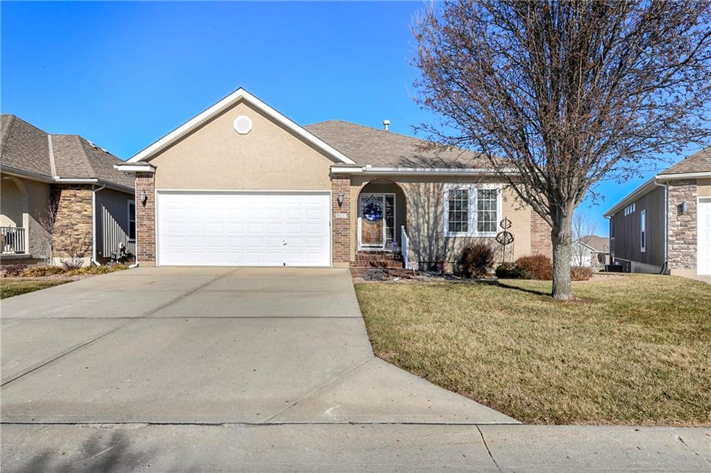 Welcome to an exceptional opportunity in the coveted The Fountains at Raintree Lake, where refined living meets the ease and comfort you deserve. This one-owner home has been meticulously maintained and reflects true pride of ownership throughout.Designed for effortless main-level living, the home features three spacious bedrooms and two full baths, along with a generous living room with gas fireplace, build-in bookcases and a wall of windows, ideal for both relaxing and entertaining. The well-appointed kitchen with custom cabinets, stainless steel appliances and granite counter tops, flows naturally into the dining area, creating an inviting space for everyday living or hosting guests. Just beyond, the screened-in porch offers a peaceful retreat, complete with steps providing convenient access to the ground level.The finished lower level significantly expands the home’s versatility, offering a wide-open recreation and family room, a fourth conforming bedroom, a wet bar, and a third full bath. In addition, a dedicated office on the lower level provides the perfect setup for working from home, managing personal projects, or creating a quiet study space. Walk out to the covered patio, where beautiful landscaping creates an ideal setting for relaxing evenings and enjoying the outdoors.  As if it couldn't get any better, there is also a central vacuum system that services the entire home.Located within a desirable 55+ lake community, residents enjoy a lifestyle centered on convenience, connection, and tranquility, all while being surrounded by the scenic beauty and amenities of Raintree Lake. Immaculate, spacious, and thoughtfully designed, this home offers the perfect blend of comfort and elegance for your next chapter.  This home would also be perfect for a multi-generational family.