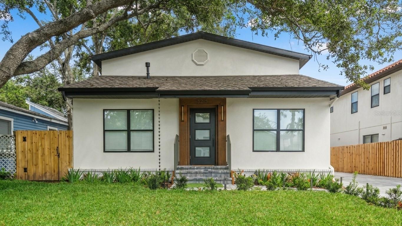 Under contract-accepting backup offers. Accepting back-offers / Welcome to a beautifully remodeled contemporary residence in the highly desirable Palma Ceia area of South Tampa. This spacious 5-bedroom, 4.5-bath home offers a bright, open layout defined by clean architectural lines, refined finishes, and a contemporary aesthetic throughout.The interior features an impressive kitchen, beautifully updated bathrooms, generous bedrooms, walk-in closets, and a private primary suite. Standout details include a custom wine display, a striking glass staircase with integrated LED lighting, and carefully selected finishes that give the home a distinctive and elevated feel.The outdoor spaces are equally impressive, featuring an outdoor grill and entertaining area, artificial turf, a private putting green, and extensive landscape lighting that enhances the property and creates a dramatic evening setting. A large paver driveway, covered outdoor area, and detached garage provide additional functionality and convenience.Ideally located near Bayshore Boulevard, Hyde Park, SoHo, Downtown Tampa, premier dining, shopping, and entertainment, this move-in-ready Palma Ceia residence offers a seamless blend of contemporary design, comfort, and exceptional indoor-outdoor living.