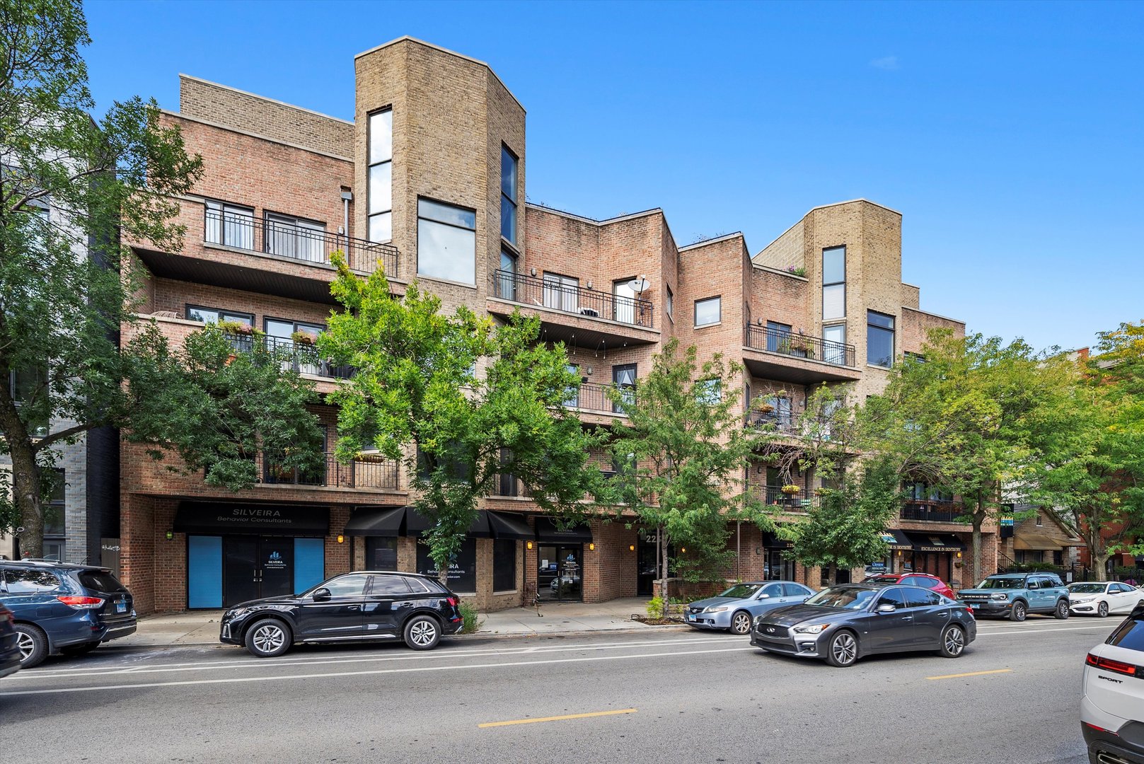 Prime Bucktown Location! Sun-filled and spacious 2-bedroom, 2-bath condo in a rare boutique elevator building. This oversized floorplan features an open chef's kitchen, dining area, and living room with a cozy gas fireplace. The large master suite includes a walk-in closet, while additional storage abounds-coat closet, linen closet, pantry, side-by-side washer/dryer, and walk-in utility closet. Step out onto your private balcony to enjoy southern exposure from both the main living space and master bedroom. The sale includes an extra-wide attached garage parking spot, plus an additional external storage closet. Perfectly situated near new restaurants, shopping, nightlife, the 606 Trail, Holstein Park, and top-rated Pulaski Elementary right behind the building. Conveniently close to The Nook daycare, just 2 blocks from the Western Blue Line, and easy access to 90/94. Armitage Avenue itself was fully repaved a few years ago. Explore in 3D! Click the 3D button to take a virtual tour and experience every detail.