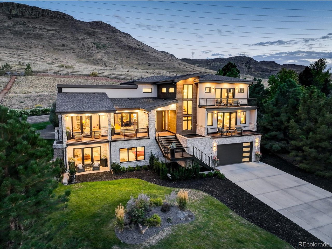 ExceptionalLuxuryEstate with Breathtaking North Table Front Range Mountain Views!Situated on an expansive 35,000 SF lot, adjacent to Jeffco Park (approximately 0.8 acres), this extraordinary MAG Builders home offers refinedluxury,exceptionaloutdoor living, and an unmatched Colorado lifestyle. Completely updated with high-end custom finishes throughout, the residence features a gourmet kitchen with Sub-Zero and Wolf appliances and hidden "peekaboo" pantry, main-floor primary suite, second-floor primary , five full baths plus powder bath, designer walk-in closets, multiple balconies, and breathtaking views from nearly every window.Notable features and upgrades include:Approximately $220,000 in professional landscaping and outdoor improvementsHigh-end Michael Phelps Trainer 15 in-ground swim spawith dedicated pool-room shed/outbuildingPerimeter snake/rodent fencingSmart water valve systemCustom outdoor kitchen with BBQ grill and refrigerator surrounded by Quartzite countertops Approximately $60,000 in custom window treatmentsUpgraded designer light fixtures throughoutTwo A/C units and two furnaces which adds Zoned heating/coolingAnti-fog mirrors in the primary suites and secondary bathroomHeated floors in both primary suitesSteam shower in the main-floor primary suiteWasher/dryer hookup in the main-floor primary suite, ideal for generational livingWhole-home audiovisual system with the ability to enjoy different music in individual rooms inside and outPrivate North Table Mountain accessTheexceptionaloutdoor living spaces include a custom Quartzite BBQ and entertaining area, TV, refrigerators, storage, and custom stair access to an elevated North Table Mountain & Front Range overlook. Located on Colorado's Front Range, surrounded byluxuryestates, this rare property offers privacy, spectacular views, resort-style amenities, and effortless indoor/outdoor entertaining in one of Golden's most desirable neighborhoods.