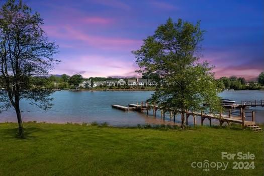 Highly sought after lake front lot is finally on the market! This beautiful.71 acre lot is centered in the heart of Sisters Cove. Dock installed!!! Come build your dream home and enjoy the lake life year round!