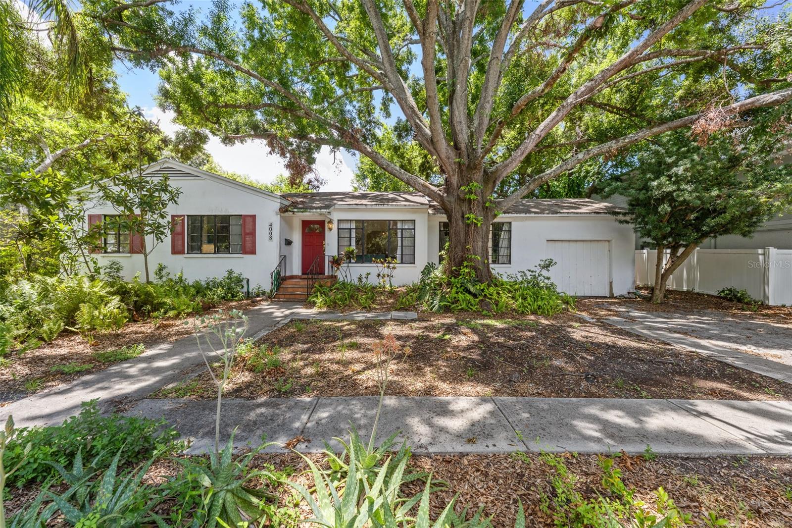Under contract-accepting backup offers. In the the Roosevelt, Coleman and Plant school districts is a 1950s block home with great bones and incredible potential. The house features three bedrooms and one and one half baths. Tongue and groove ceilings are found in some of the rooms. Original hardwood floors are in the living, dining and all three bedrooms. The home was re plumbed and new HVAC system was added in 2022. There is a large family room which
leads to a large single car garage with a loft for additional storage. It has so much potential for someone who would like to make this a special home. It sits on a large lot that is fenced in the rear. The rear has mature trees and a koi pond. Update this and it will be a treasure. And, no flooding during the storms of 2024.